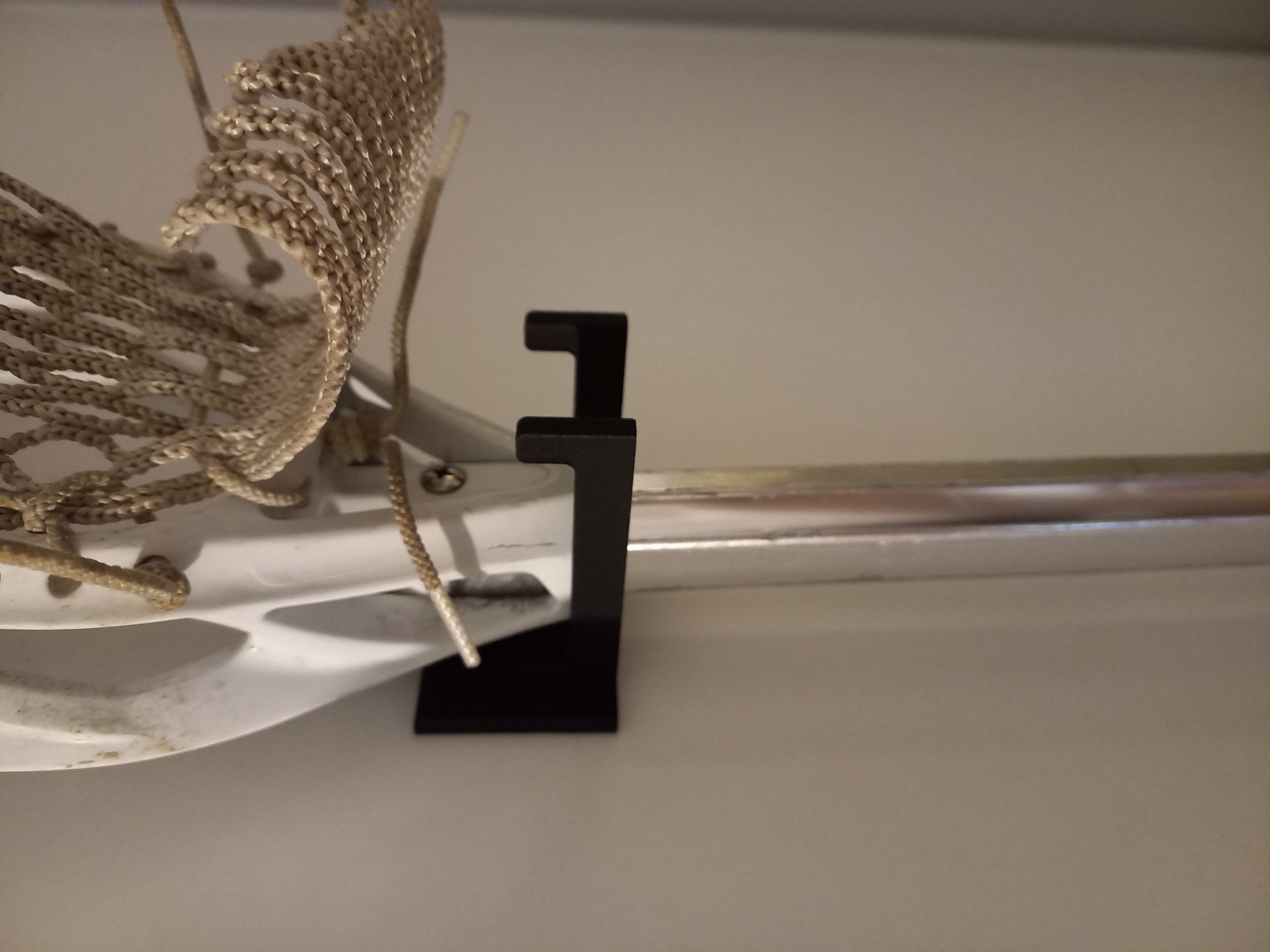 Lacrosse stick holder