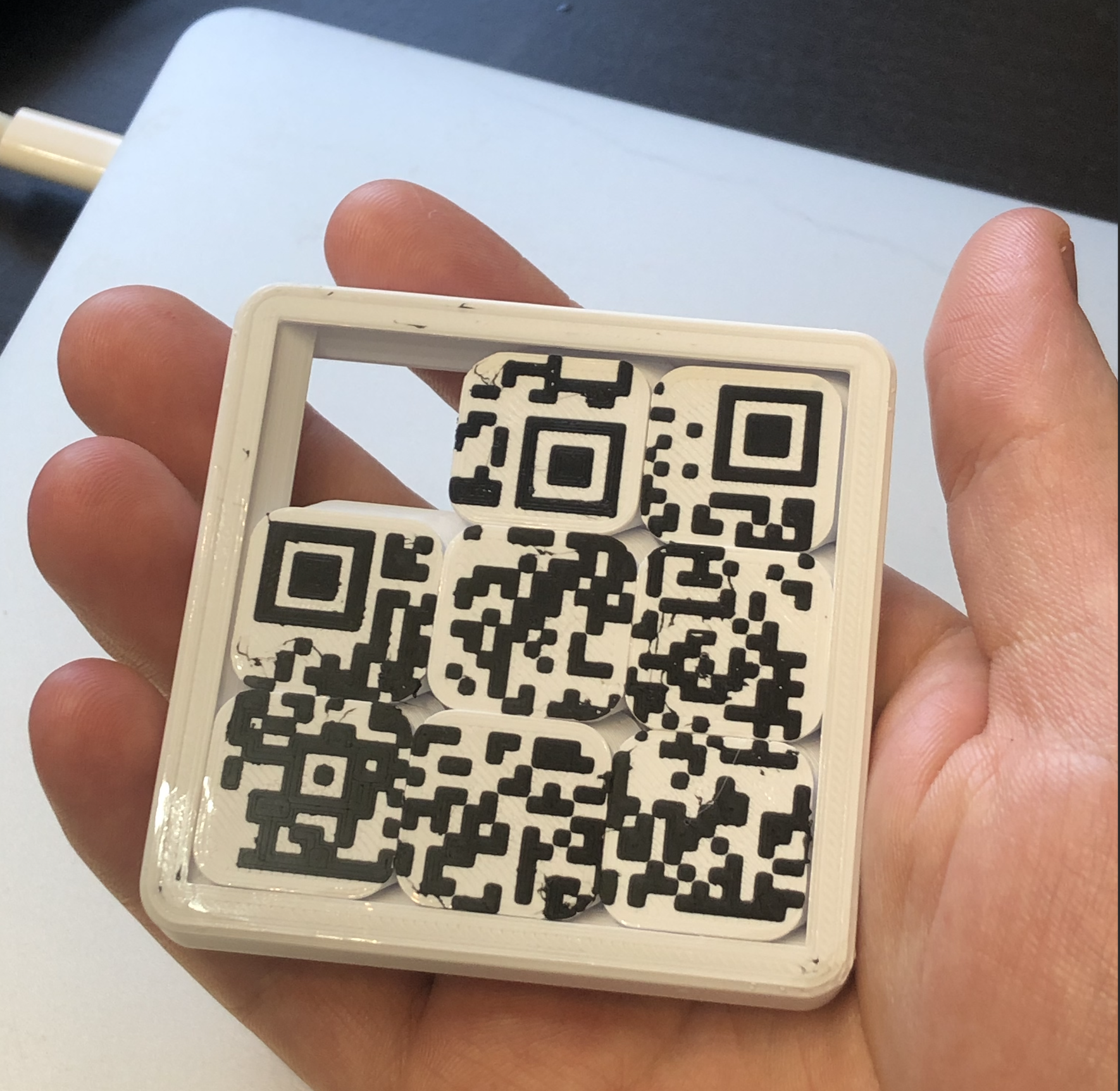 Sliding puzzle with a QR code
