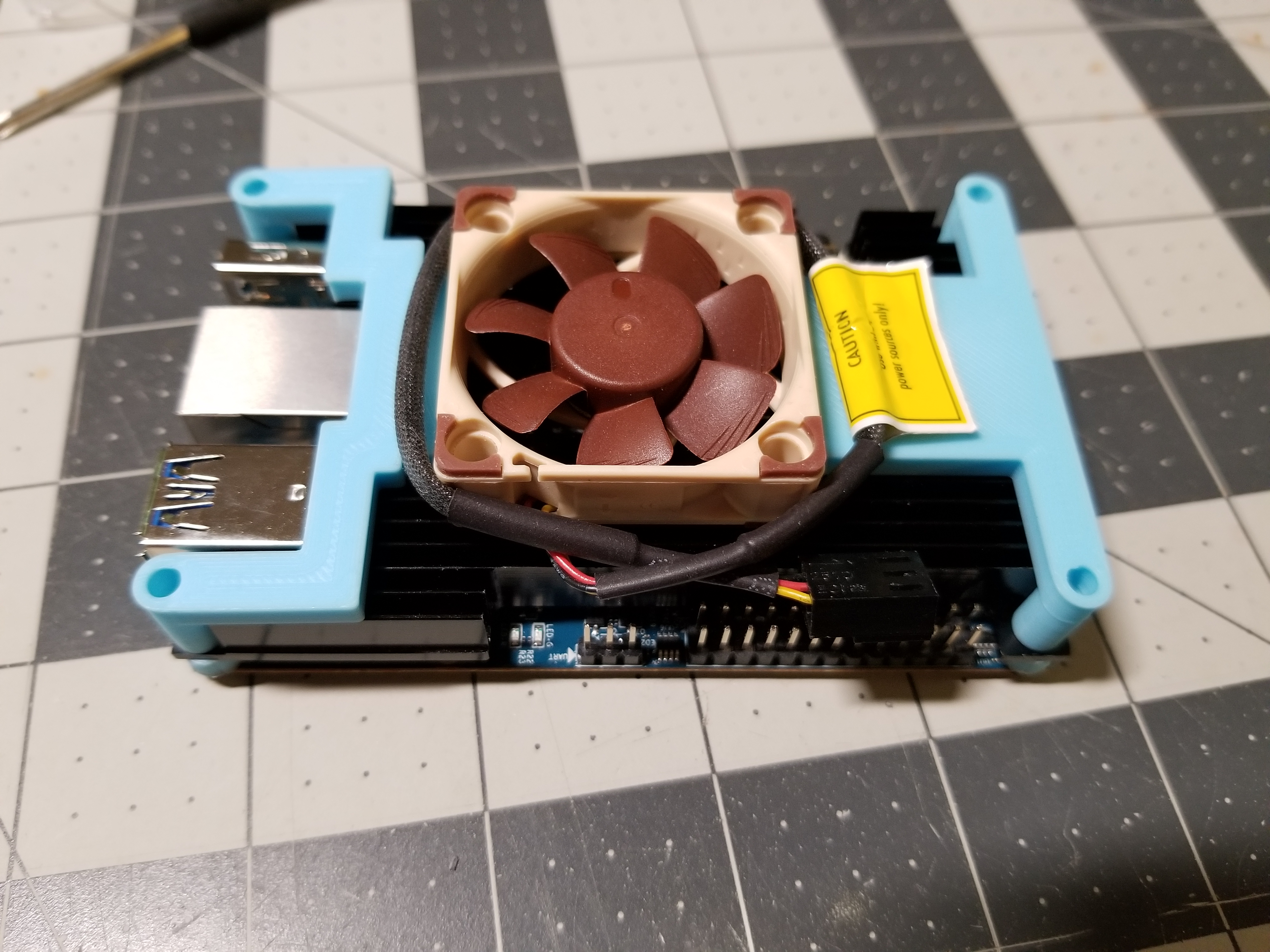 Brackets for mounting 40mm x 10mm Noctua Fan (NF-A40) on an Orange Pi 4 with the common "heatsink case".