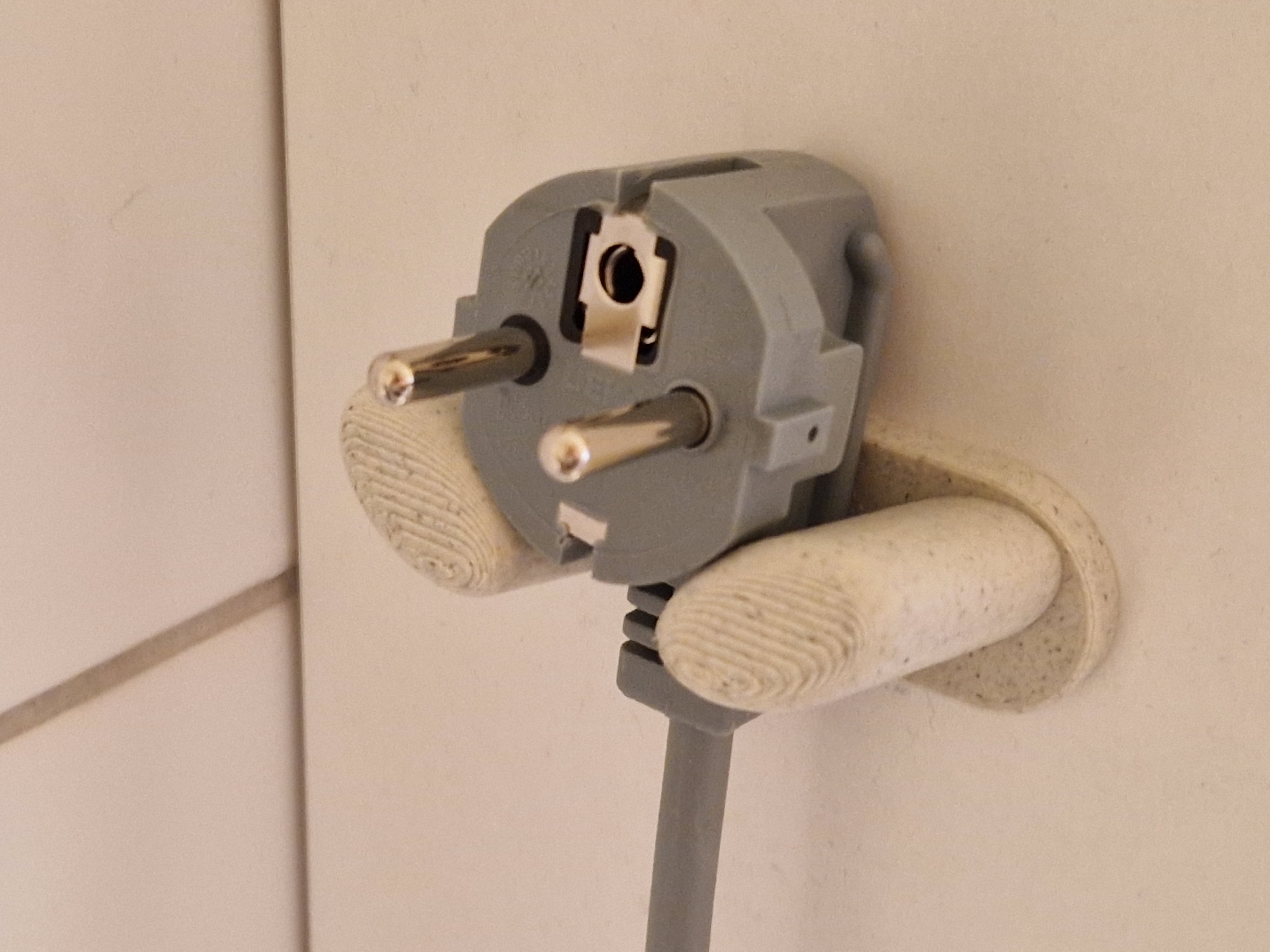 Holder/hook for Schuko plug