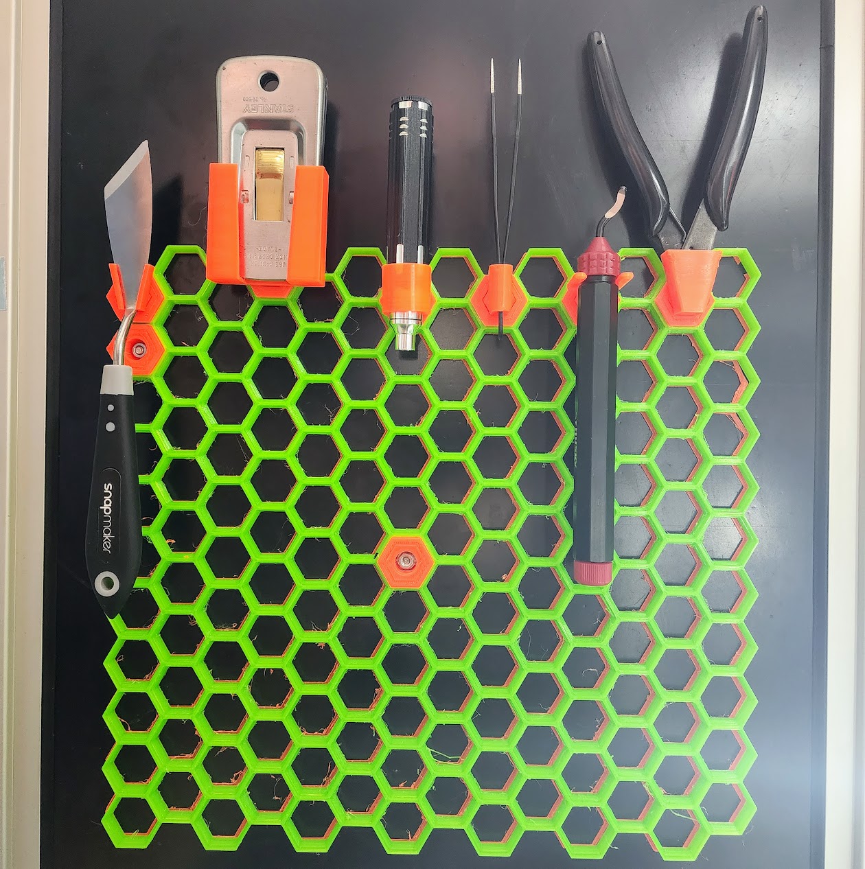 Honeycomb storage wall inserts for Snapmaker accessories.