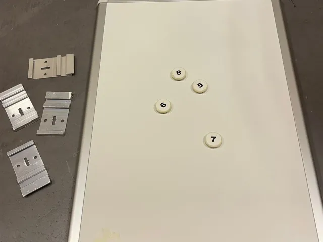Hidden mounting brackets for whiteboard/magnetic board