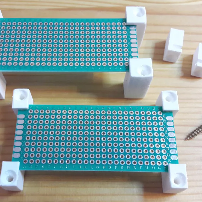 PCB mounting corners with screw holes