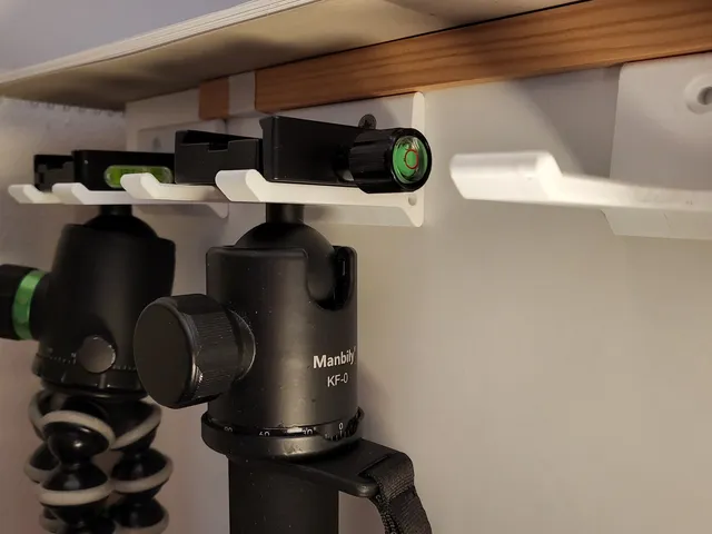 Universal tripod wall hanger