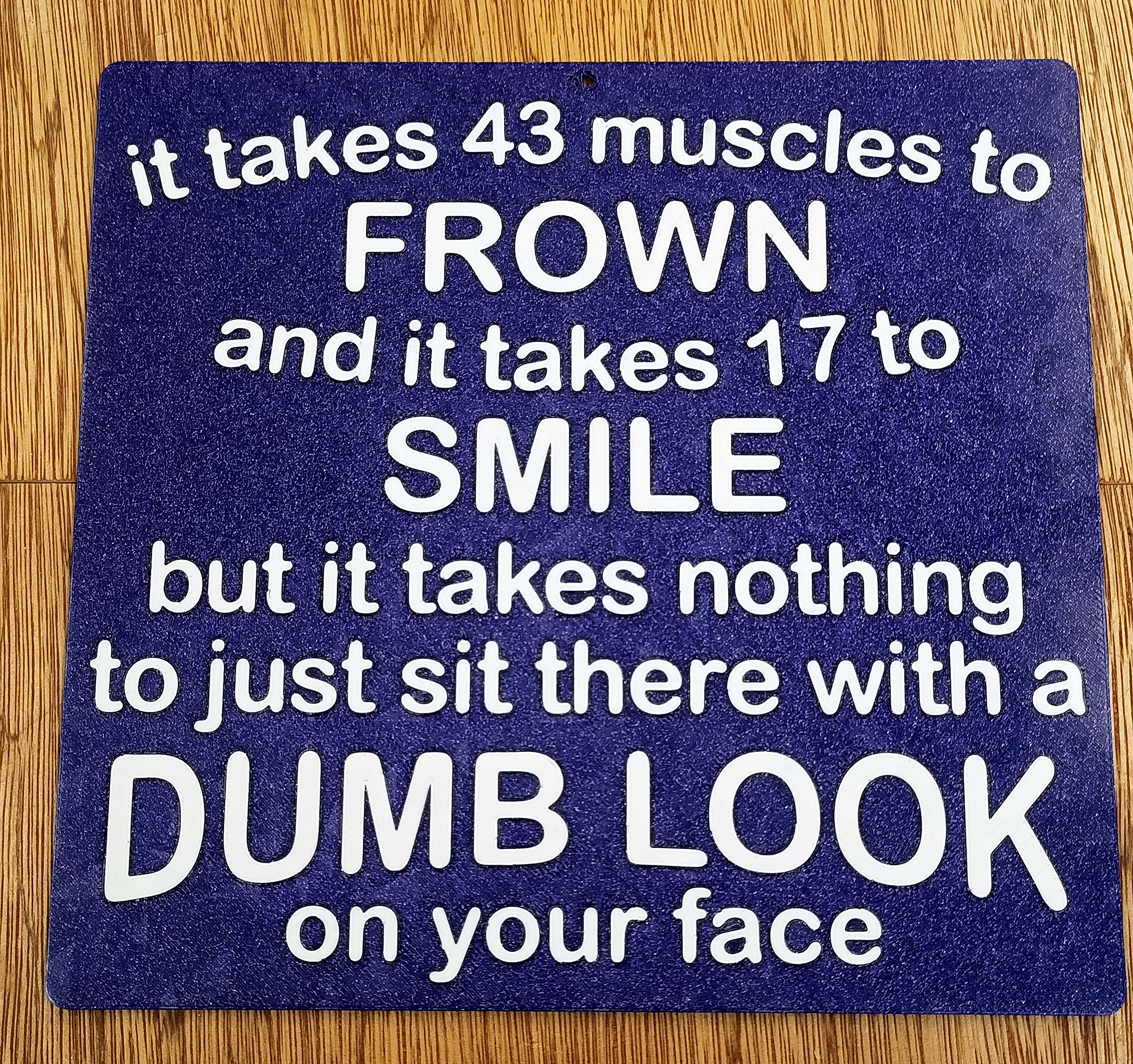 Funny Sign - "It takes 43 muscles to Frown, and it takes 17 to Smile..."