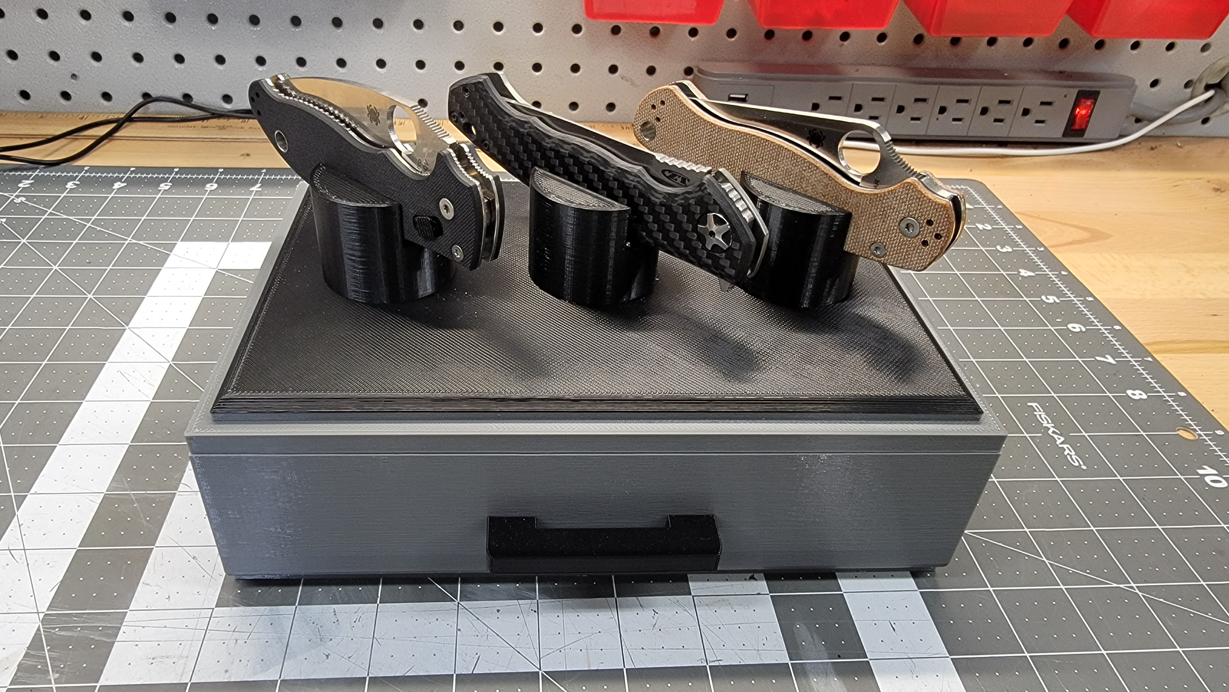 Knife display with drawer.