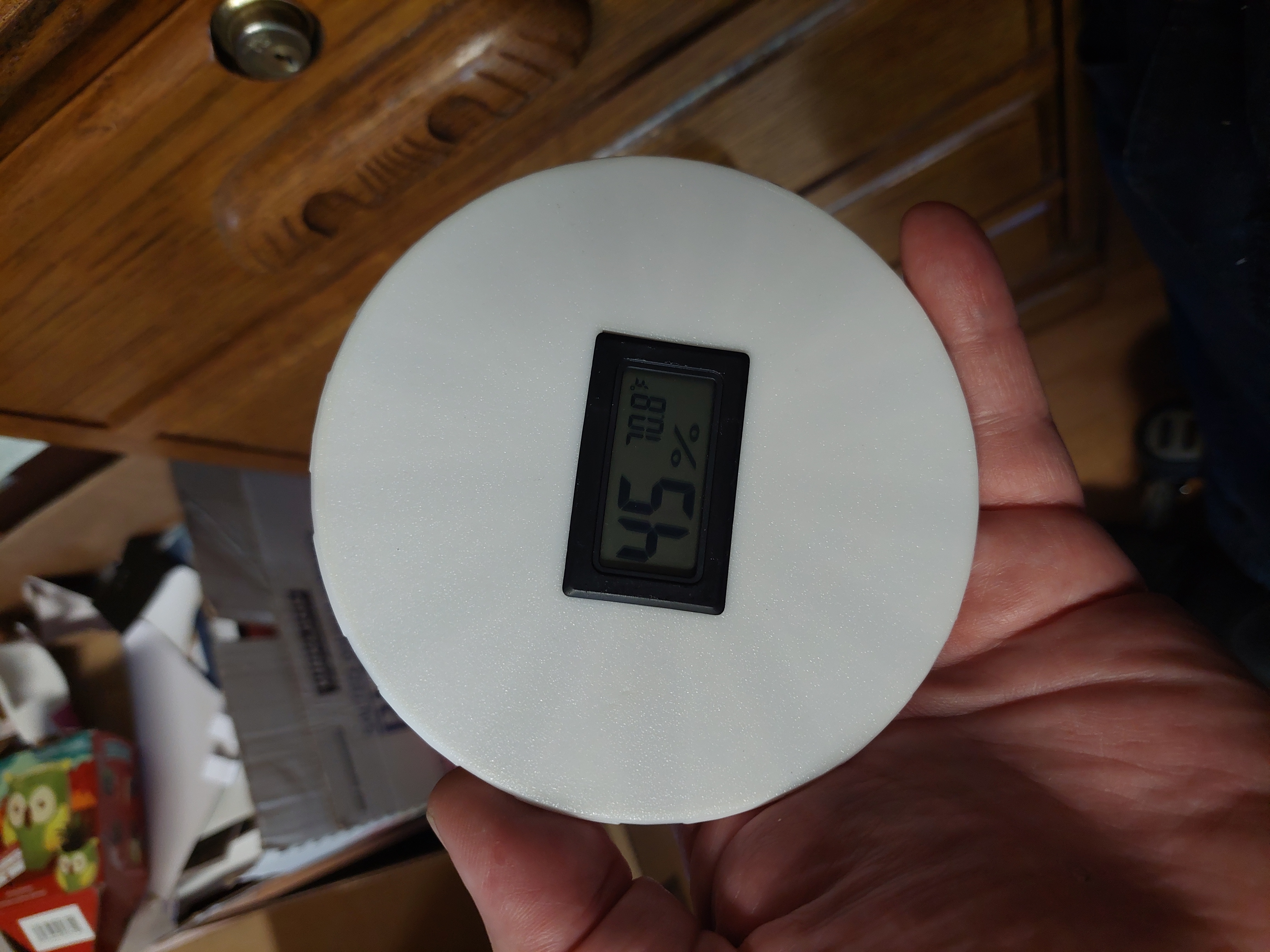 Hygrometer holder for bagged spool