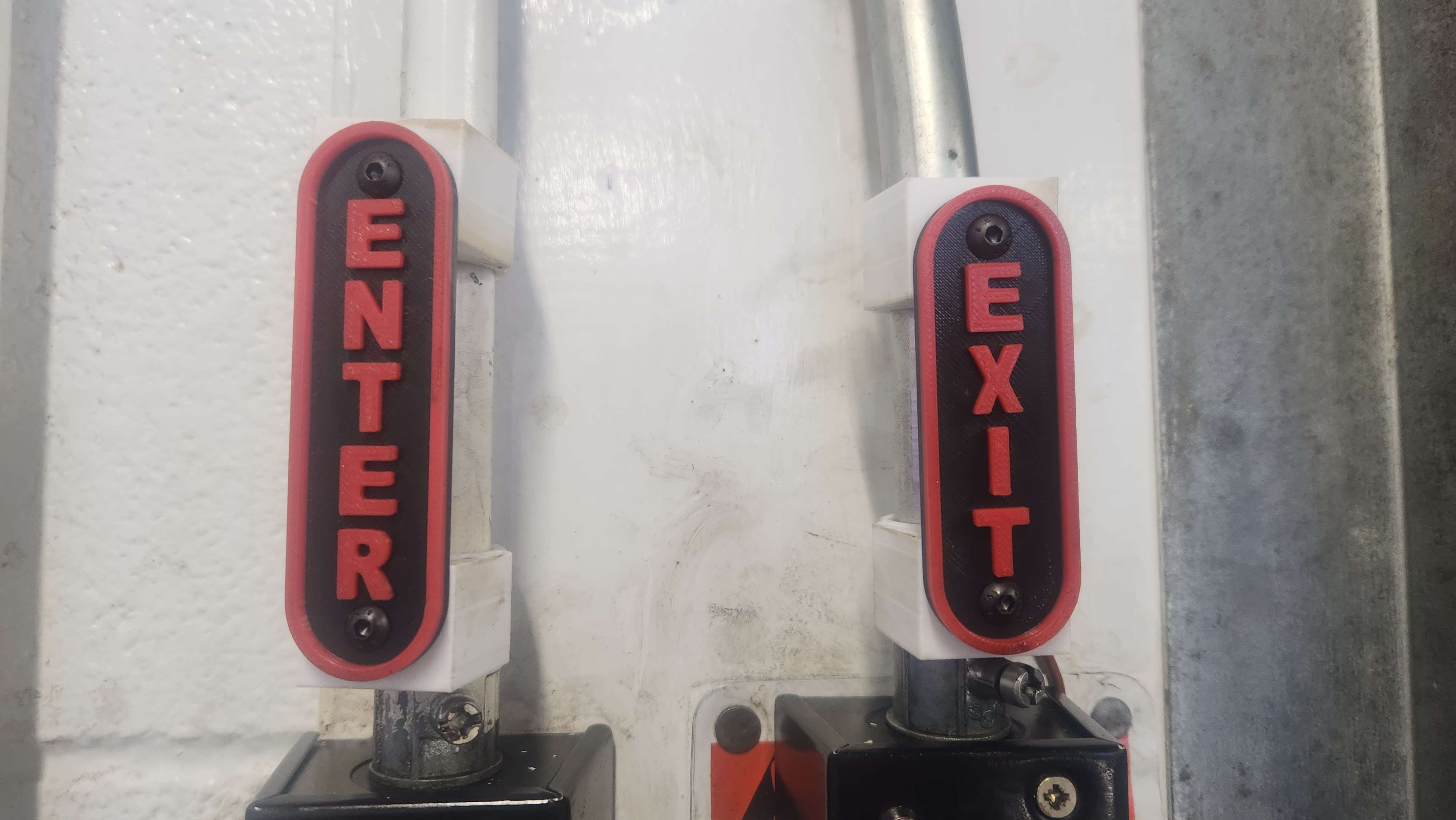 Vertical enter and exit signs