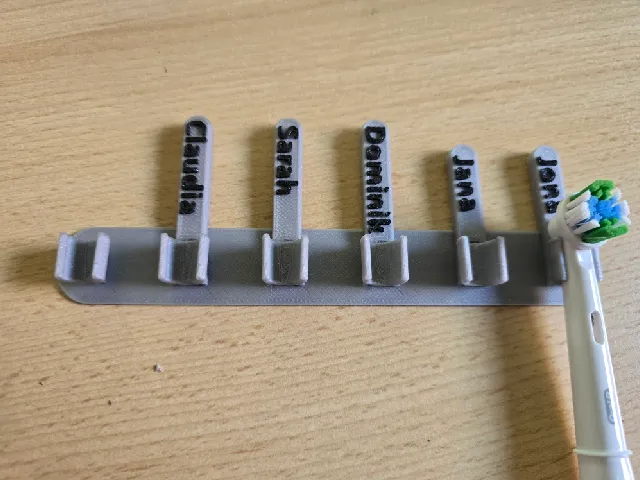 Label for Oral-B toothbrush head holder wall/cabinet door mount