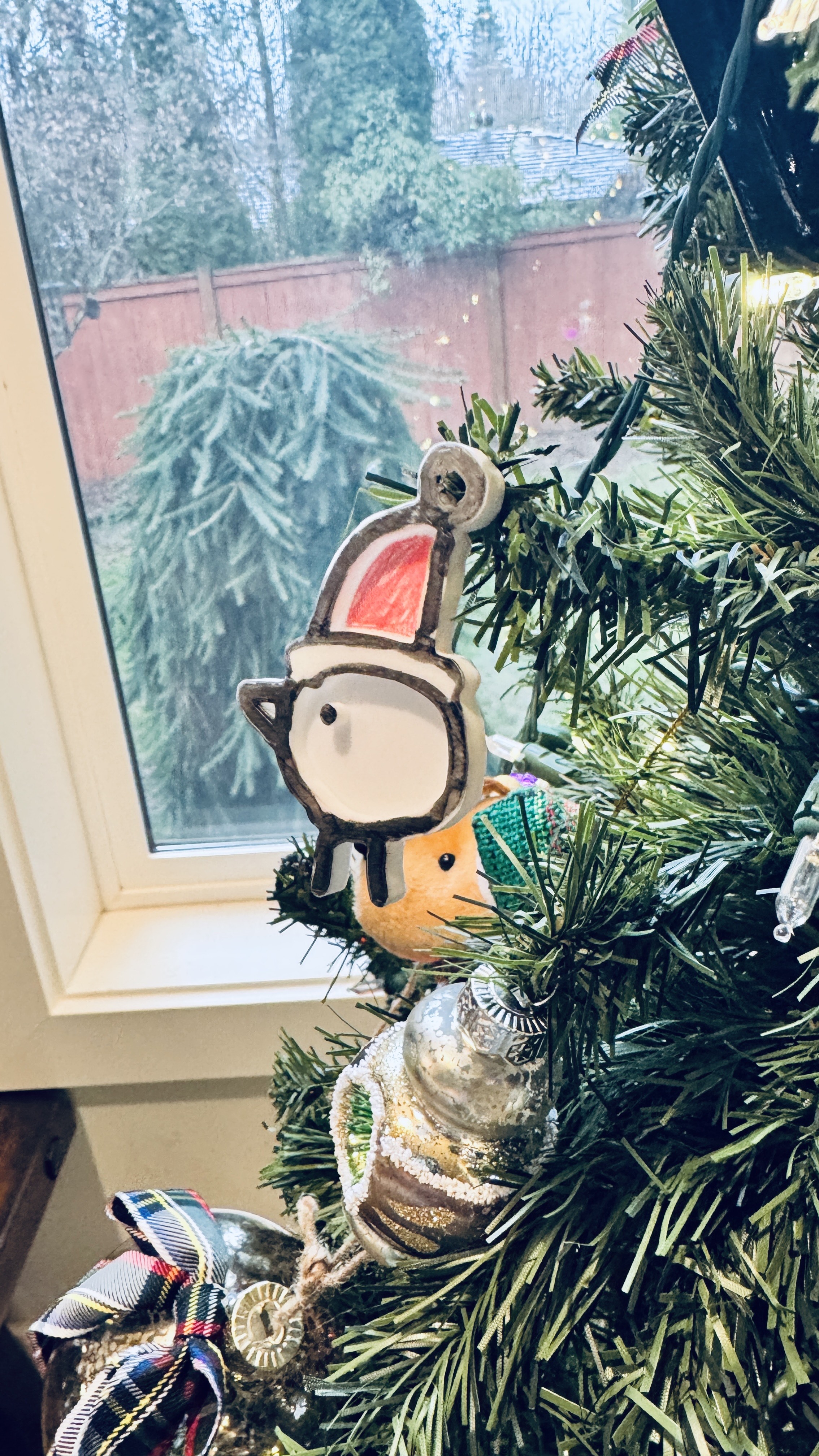 Santa canary bird and sled ornament