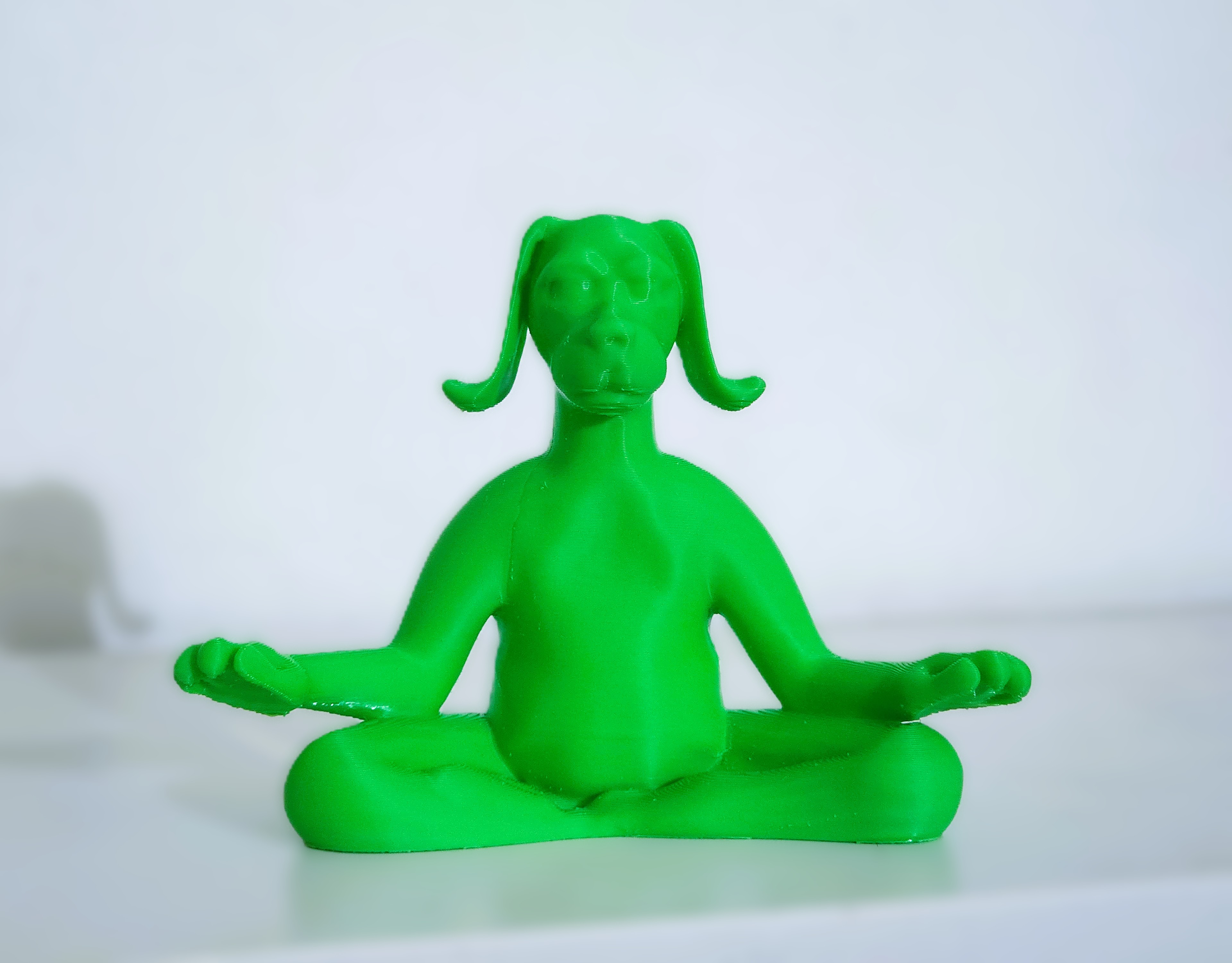 Meditating dog yoga sculpture