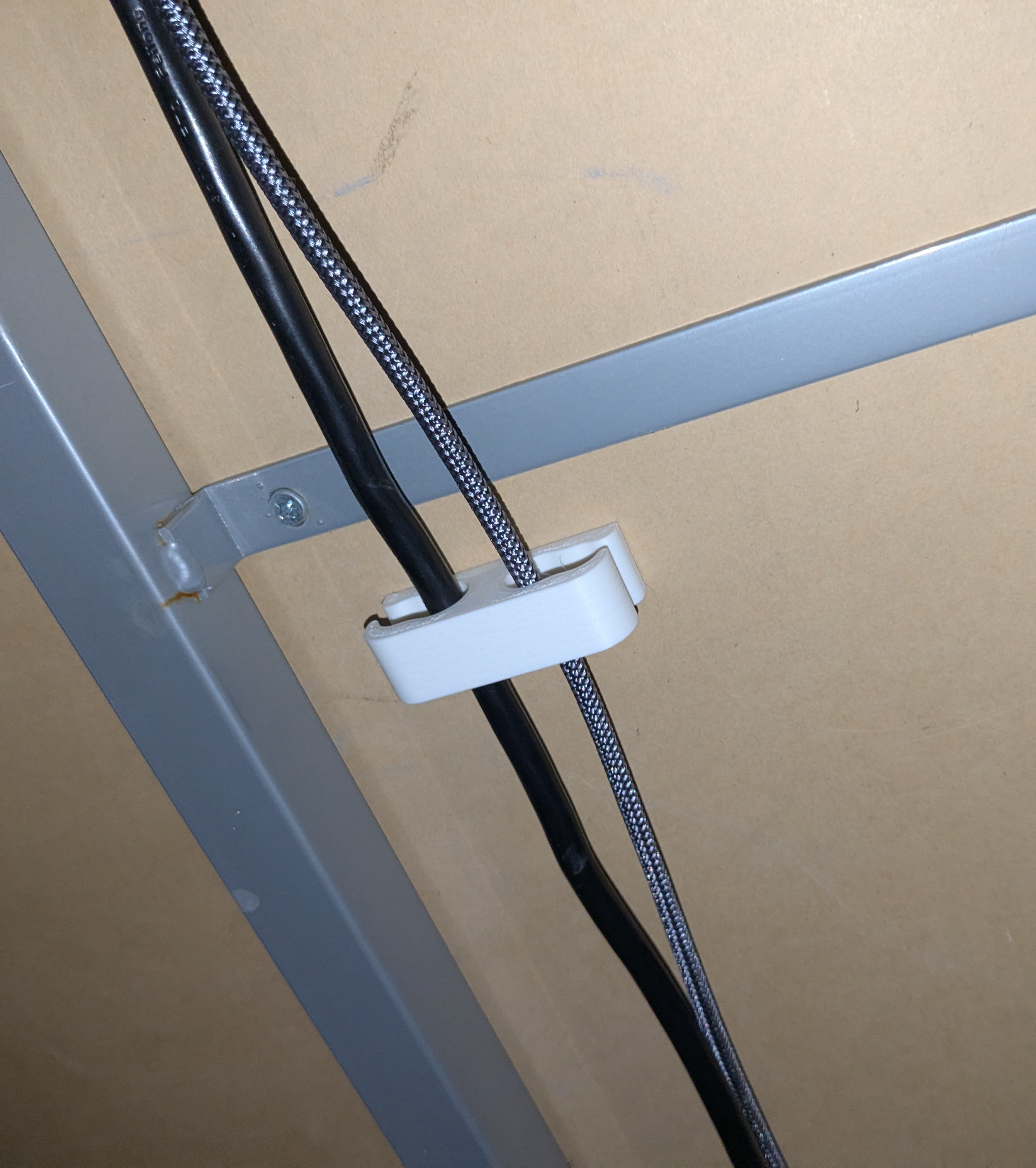 Under-desk cable guide