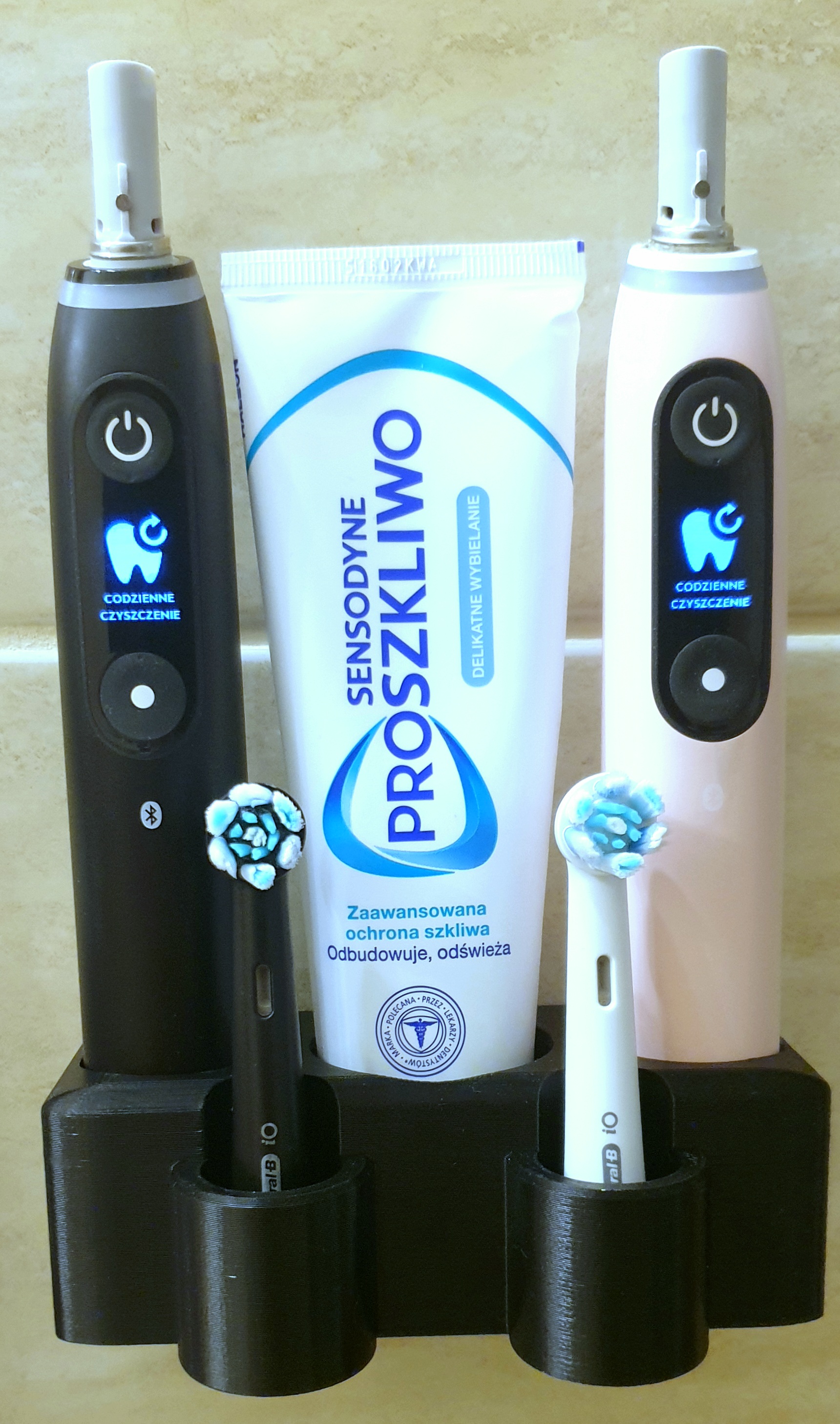 Wall mount for two Oral-B iO toothbrushes and a tube of toothpaste - no drilling required