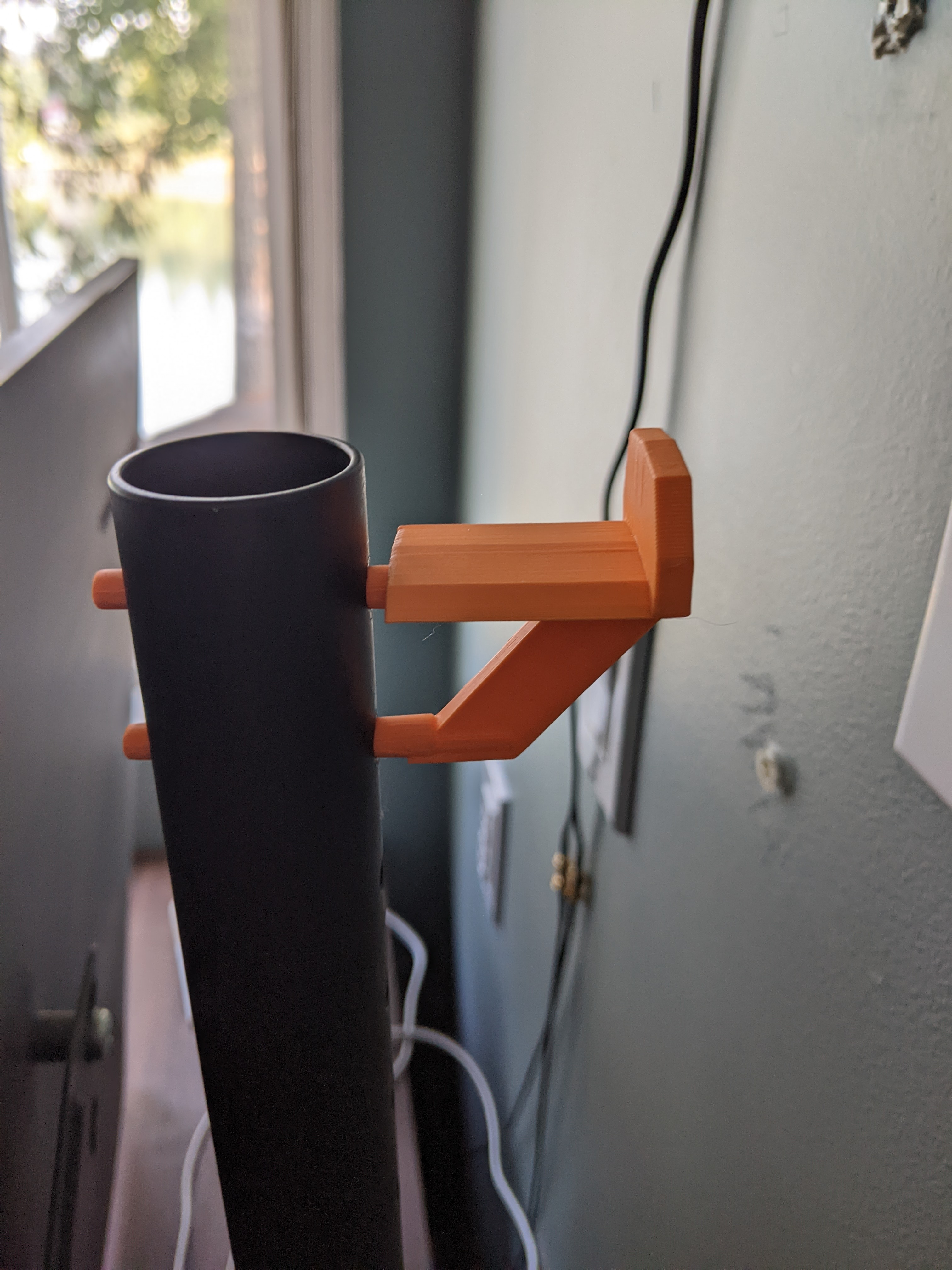 headphones holder behind monitor