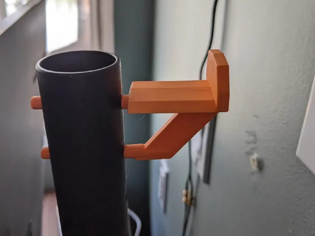 headphones holder behind monitor