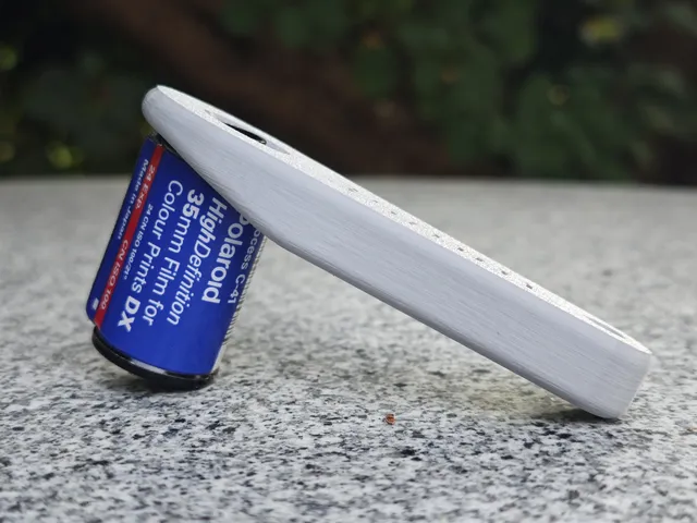 Open Film Can Opener
