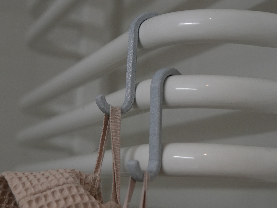 Simple hanger for bathroom heater's 20mm tubing.