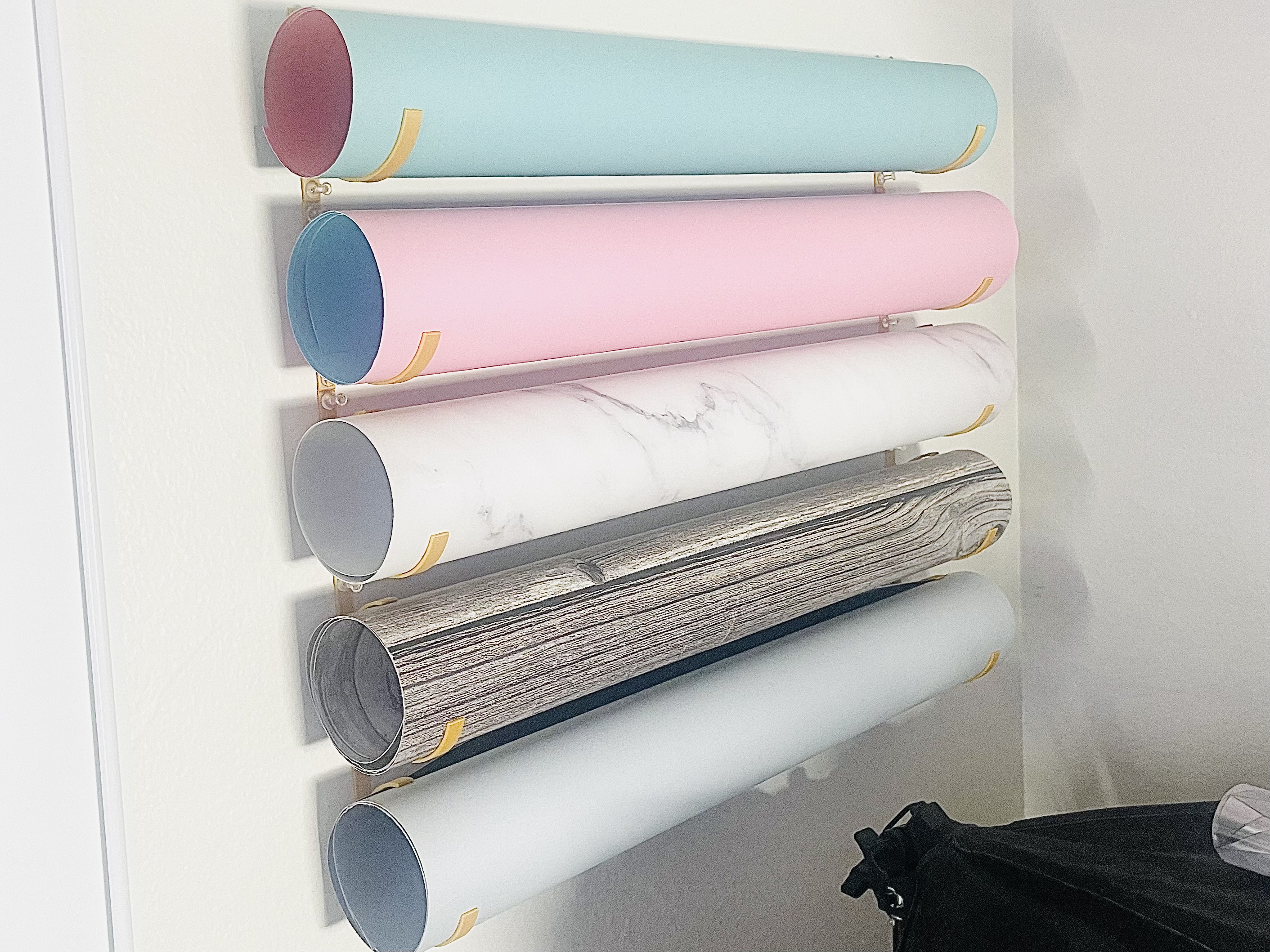 Wall Mounts for Large Rolls of Paper.