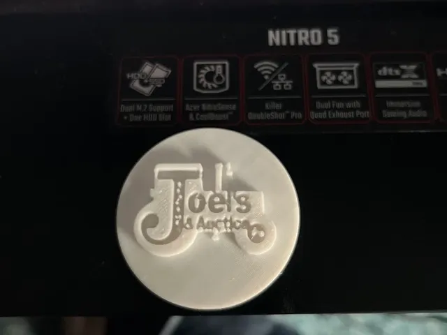 Joel's Tractors logo coin