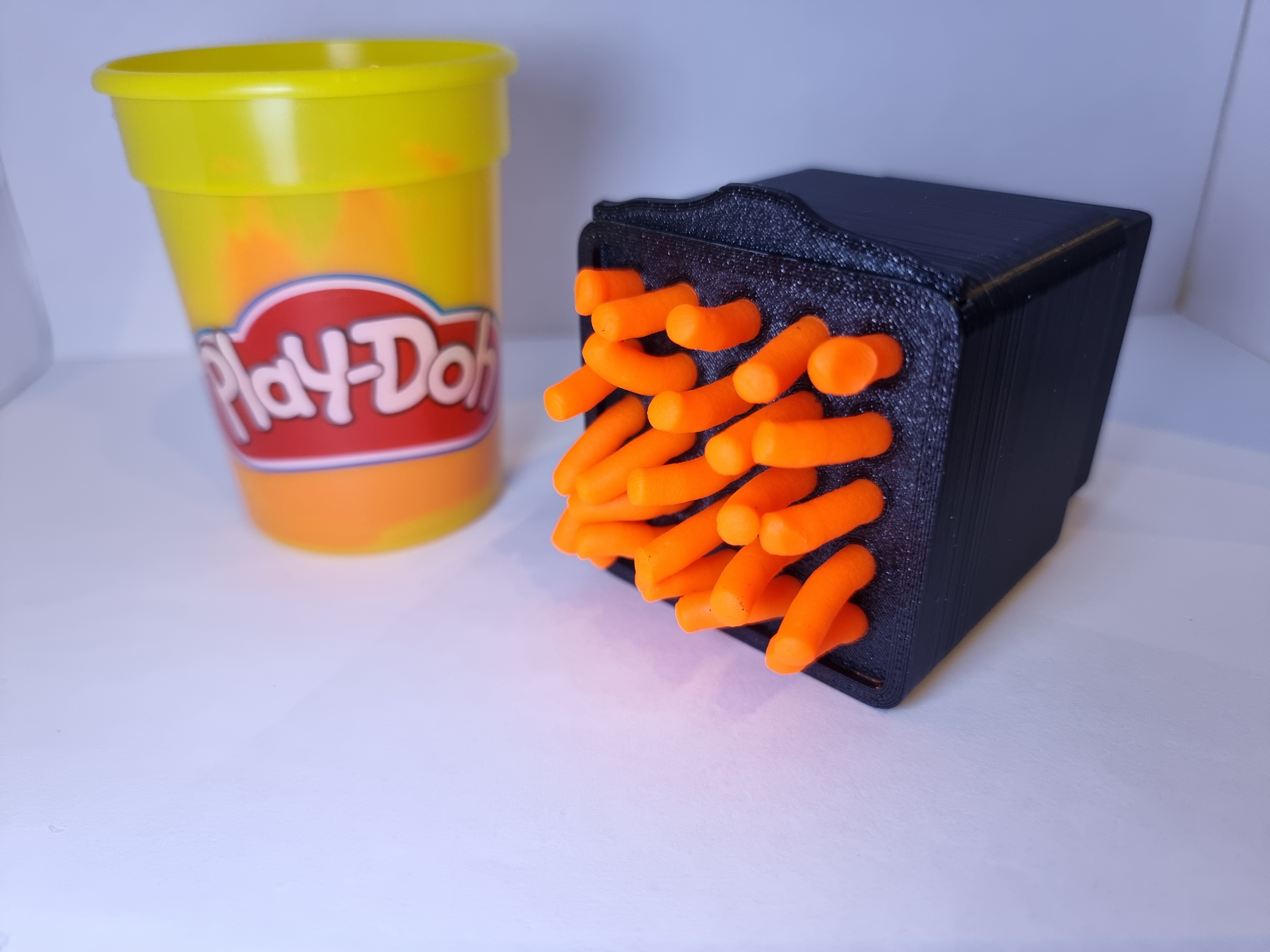 Play Doh mold with swappable plates.