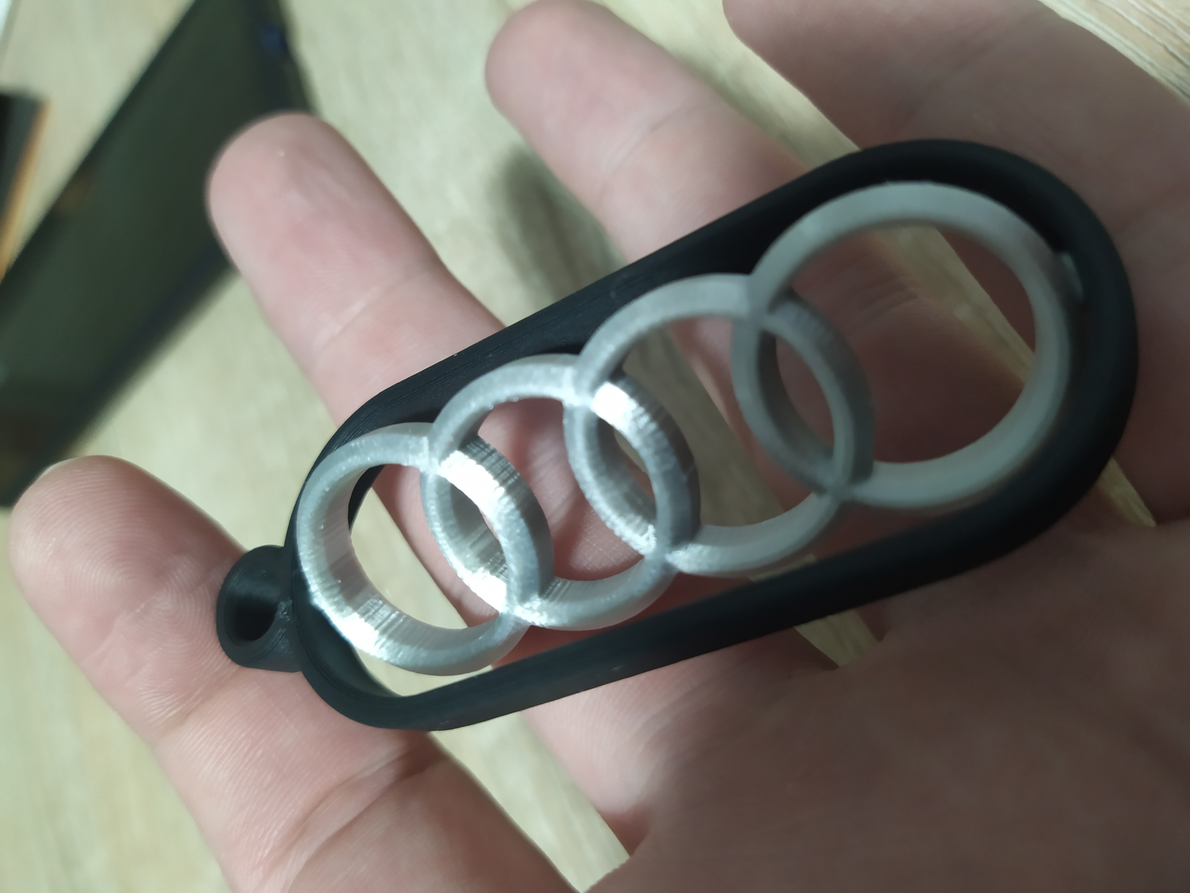 Spinning Audi keychain charm