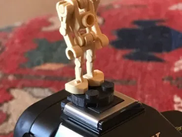 Camera hot shoe cover that is Lego Minifig base
