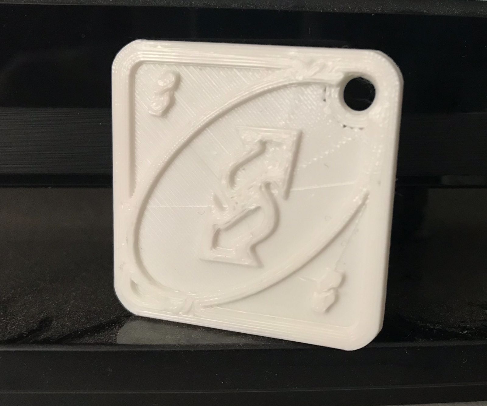 llavero de Reversa juego UNO