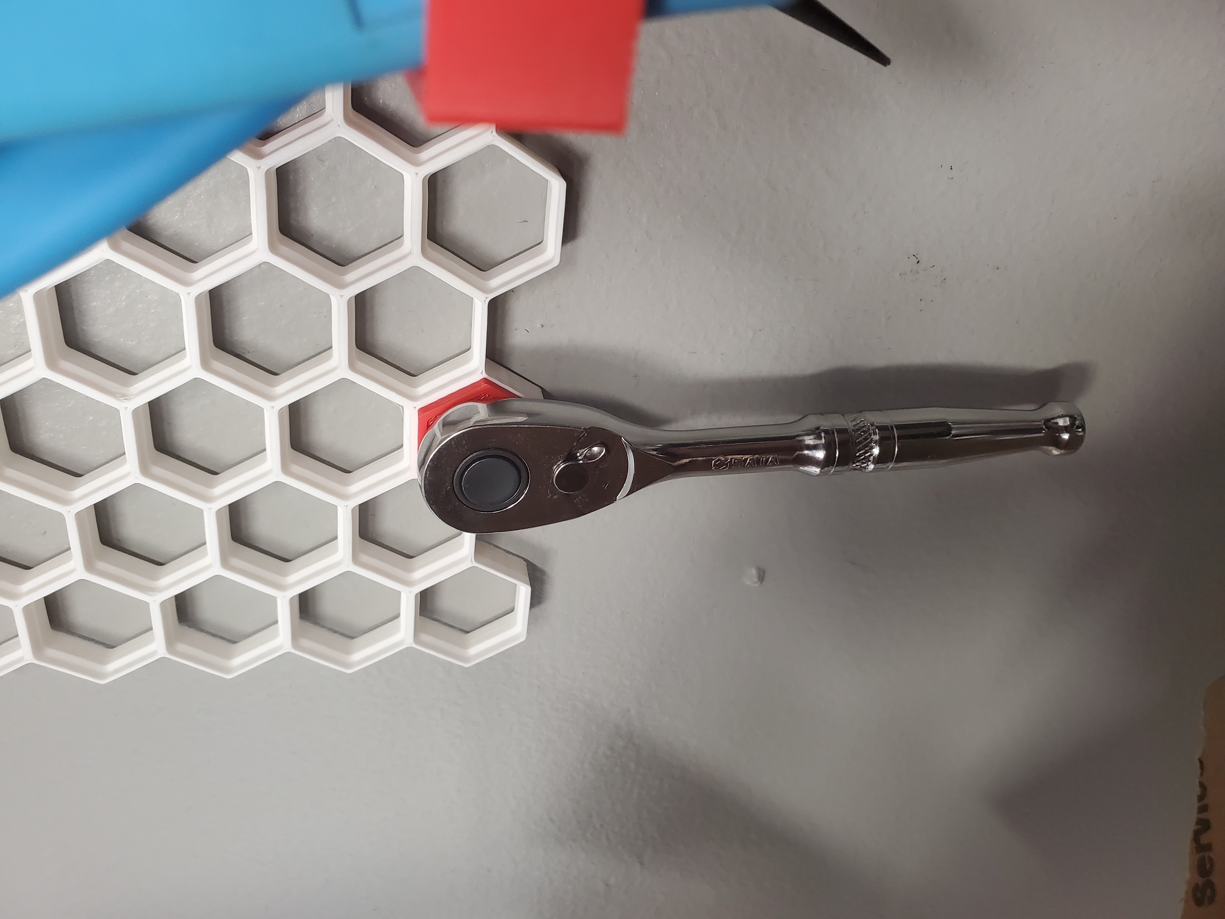 Quarter inch drive ratchet holder for Honeycomb wall