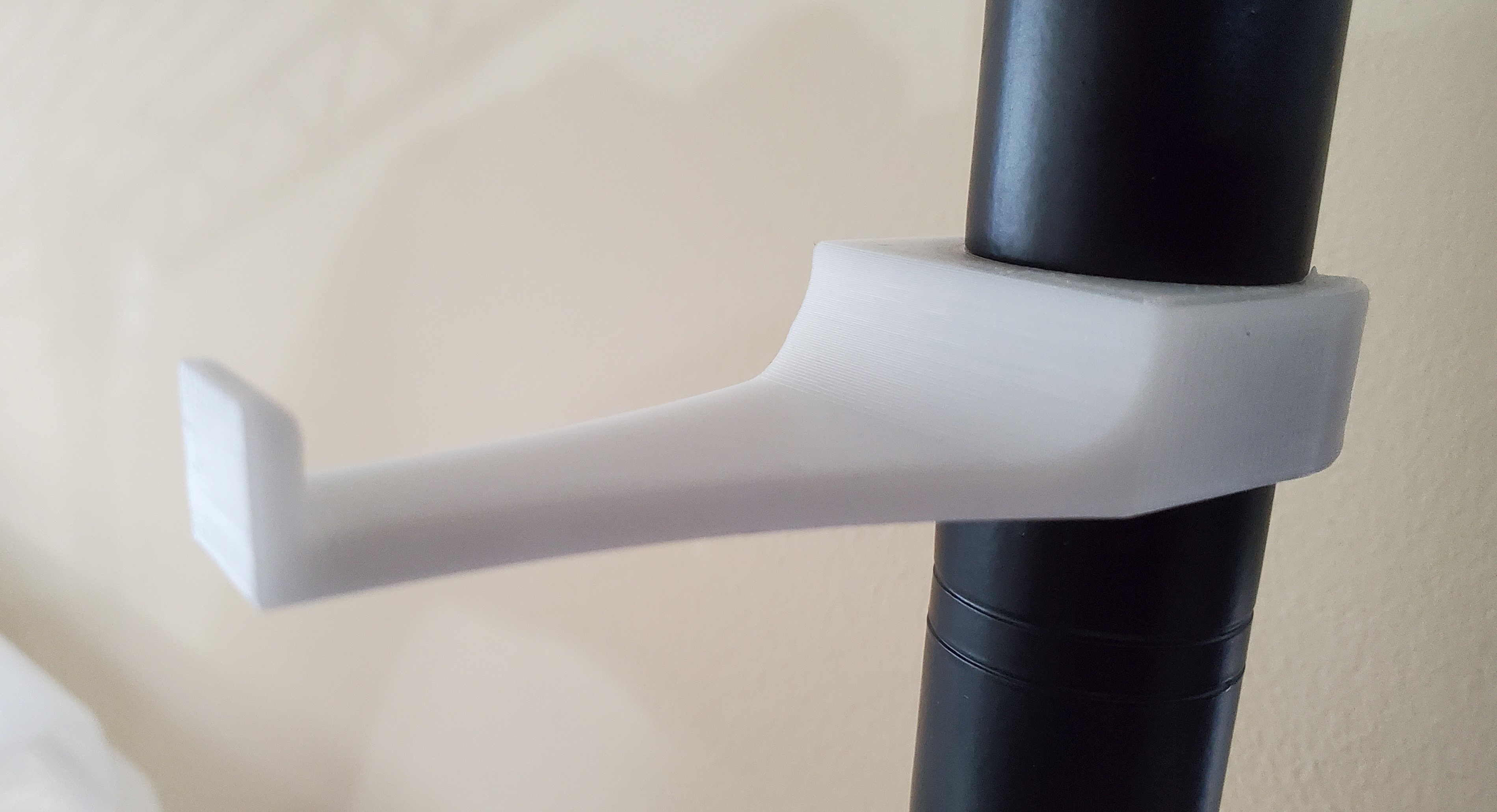 Snap on headphone hook for 1" wire shelf post pole