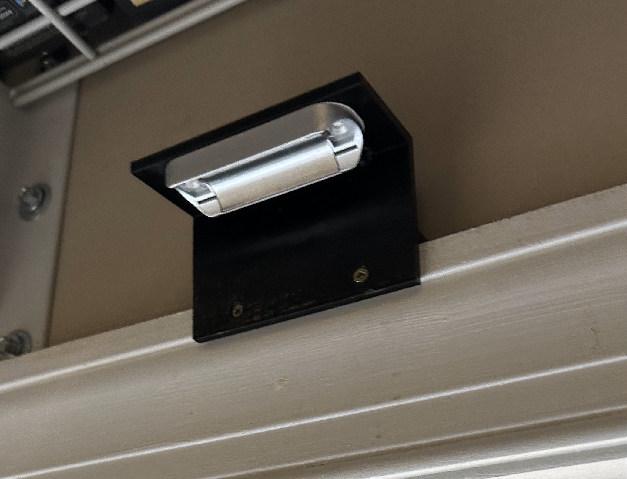 Door frame mounting bracket for a rechargeable motion sensing light