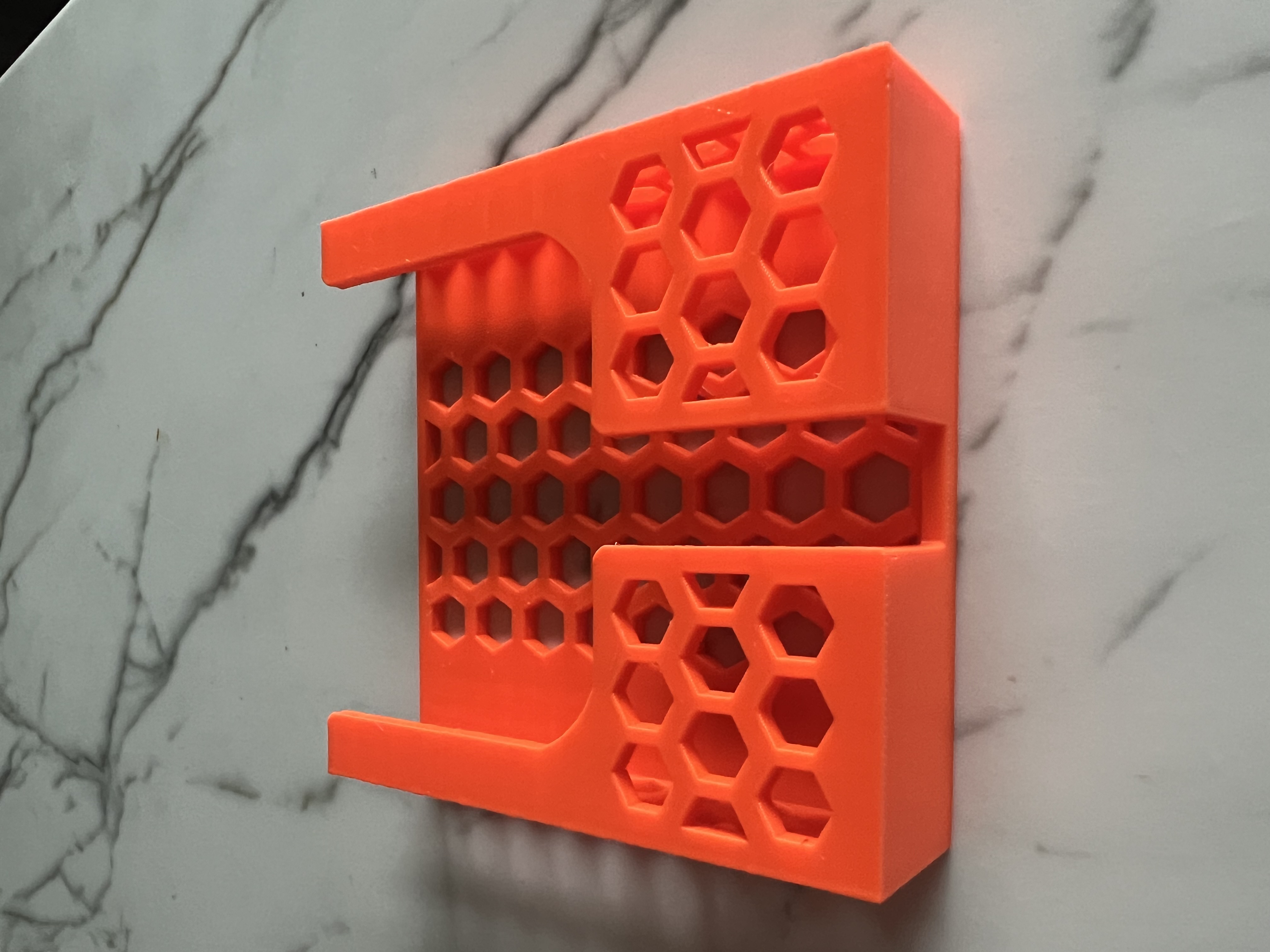 Charger friendly wall mounted phone mount