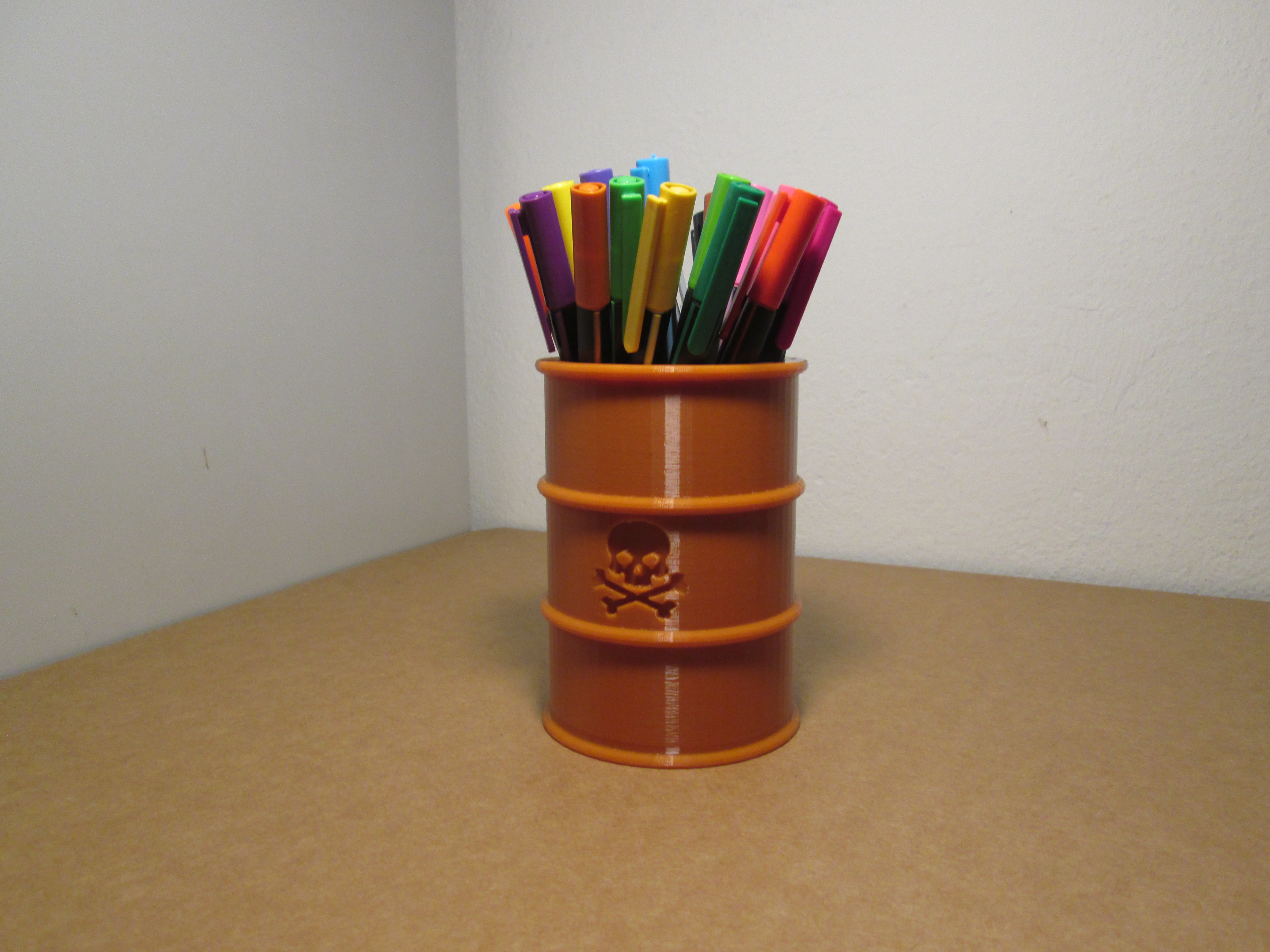 Pencil stand in the shape of a barrel