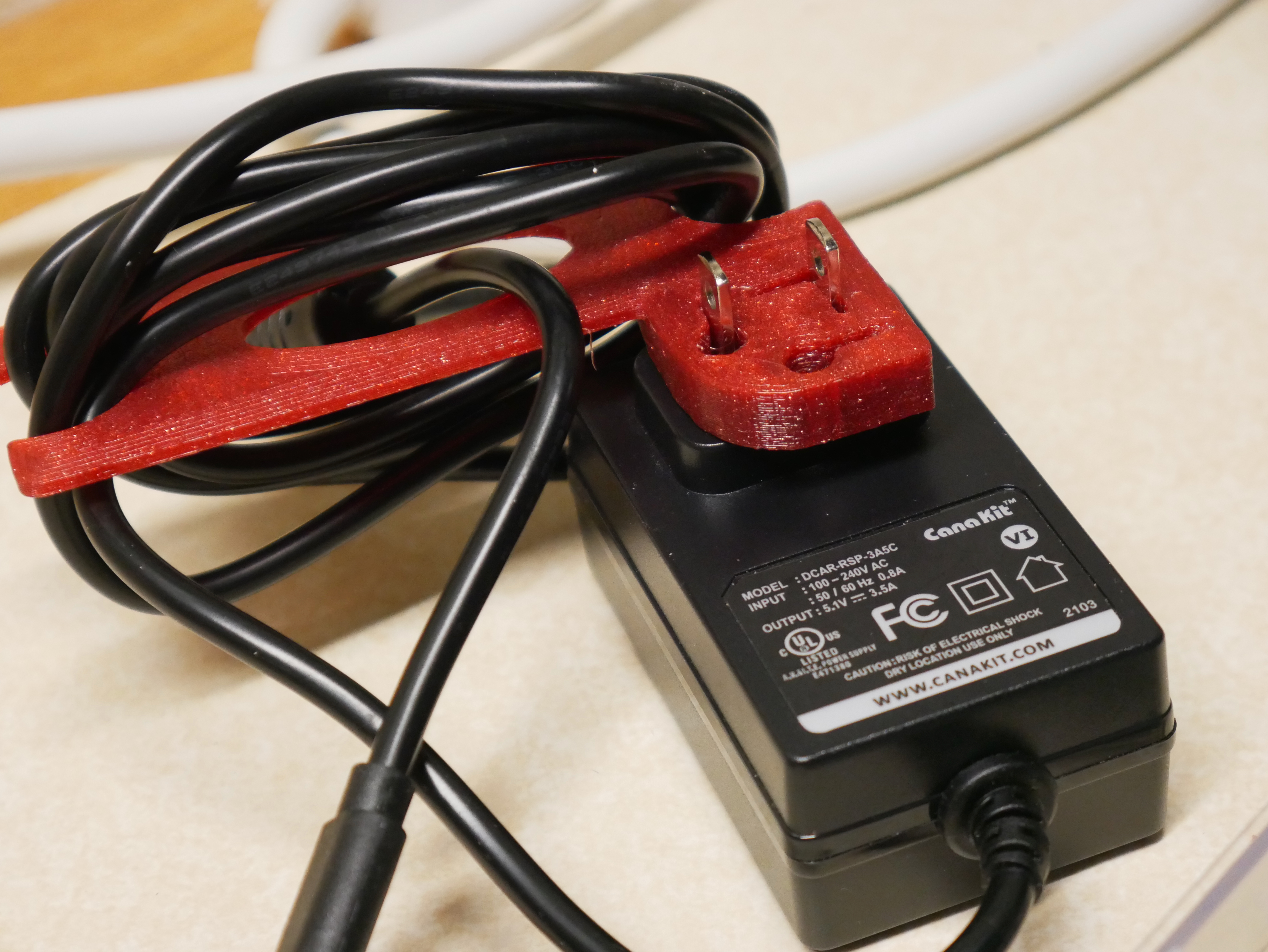 Remix: Power brick/wall wart cord wrap with improved fit and bigger cord wrap