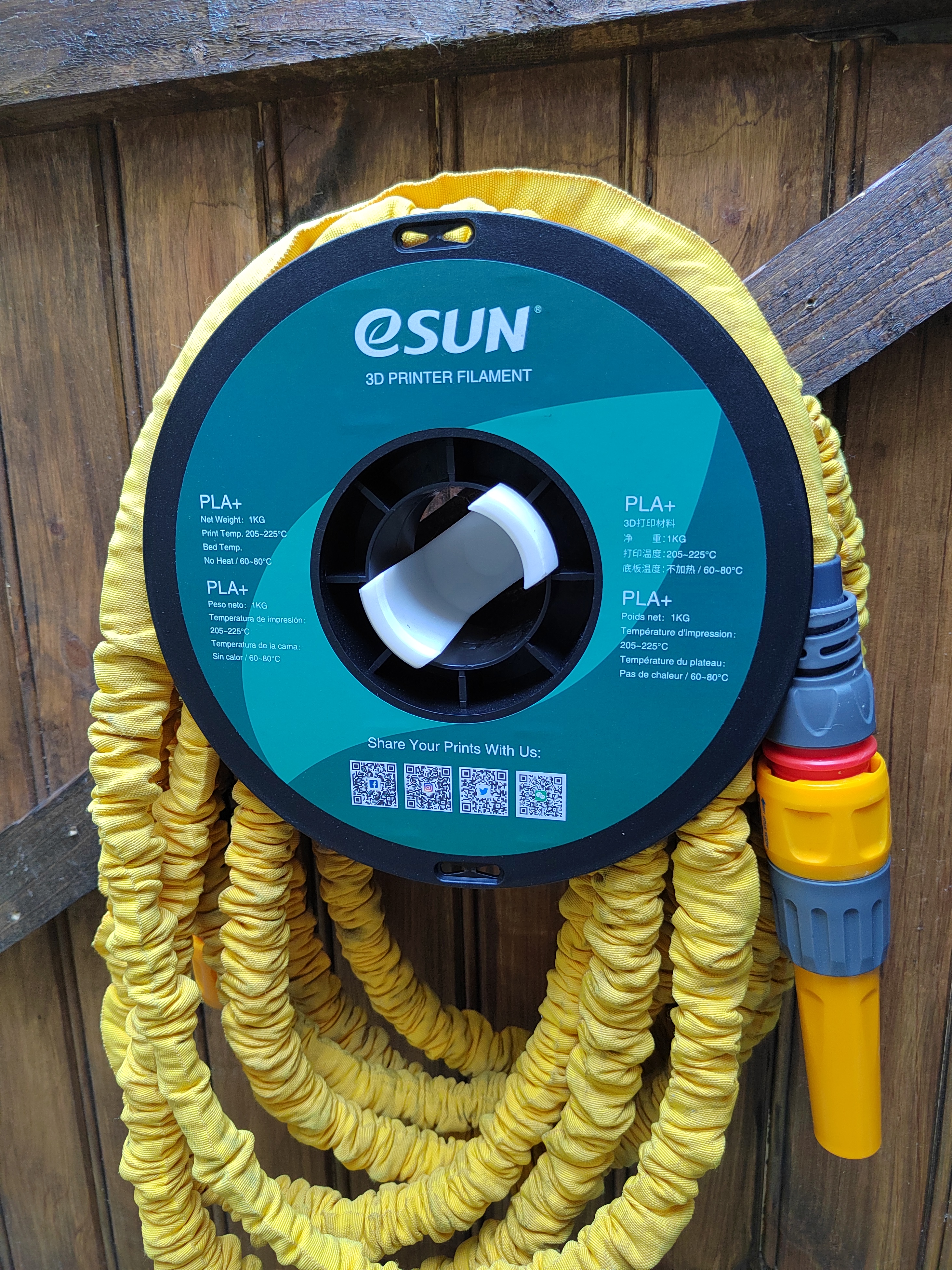 Spool holder for garden hose