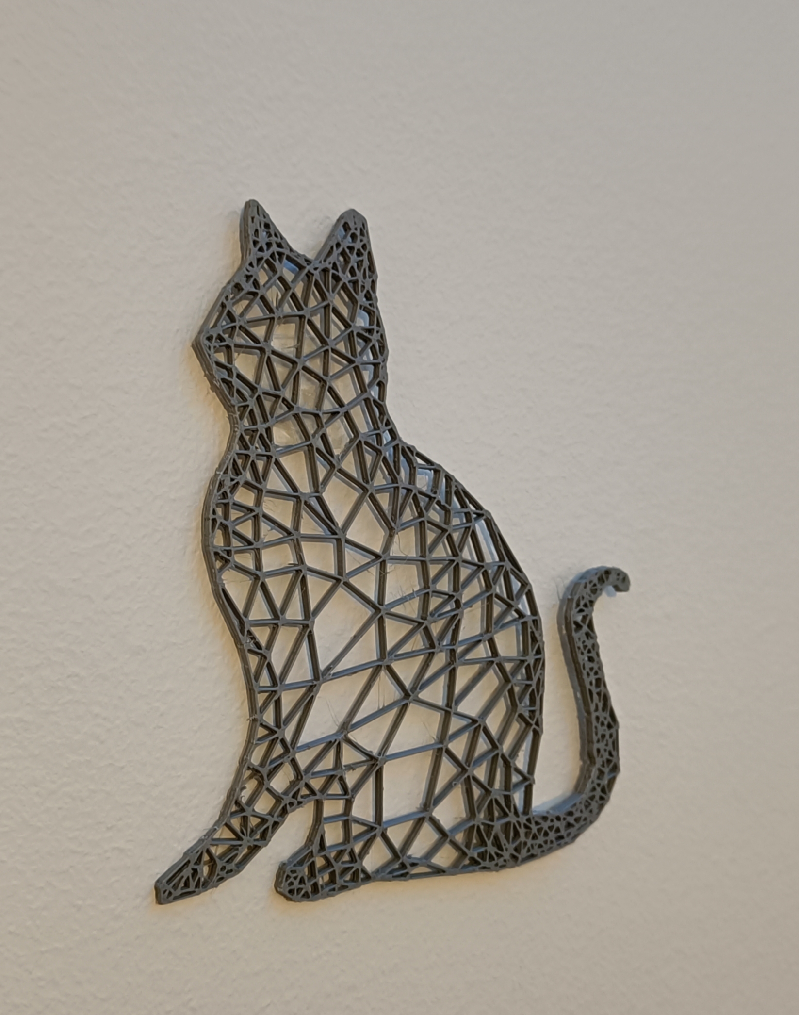 Wireframe stylized cat sculpture