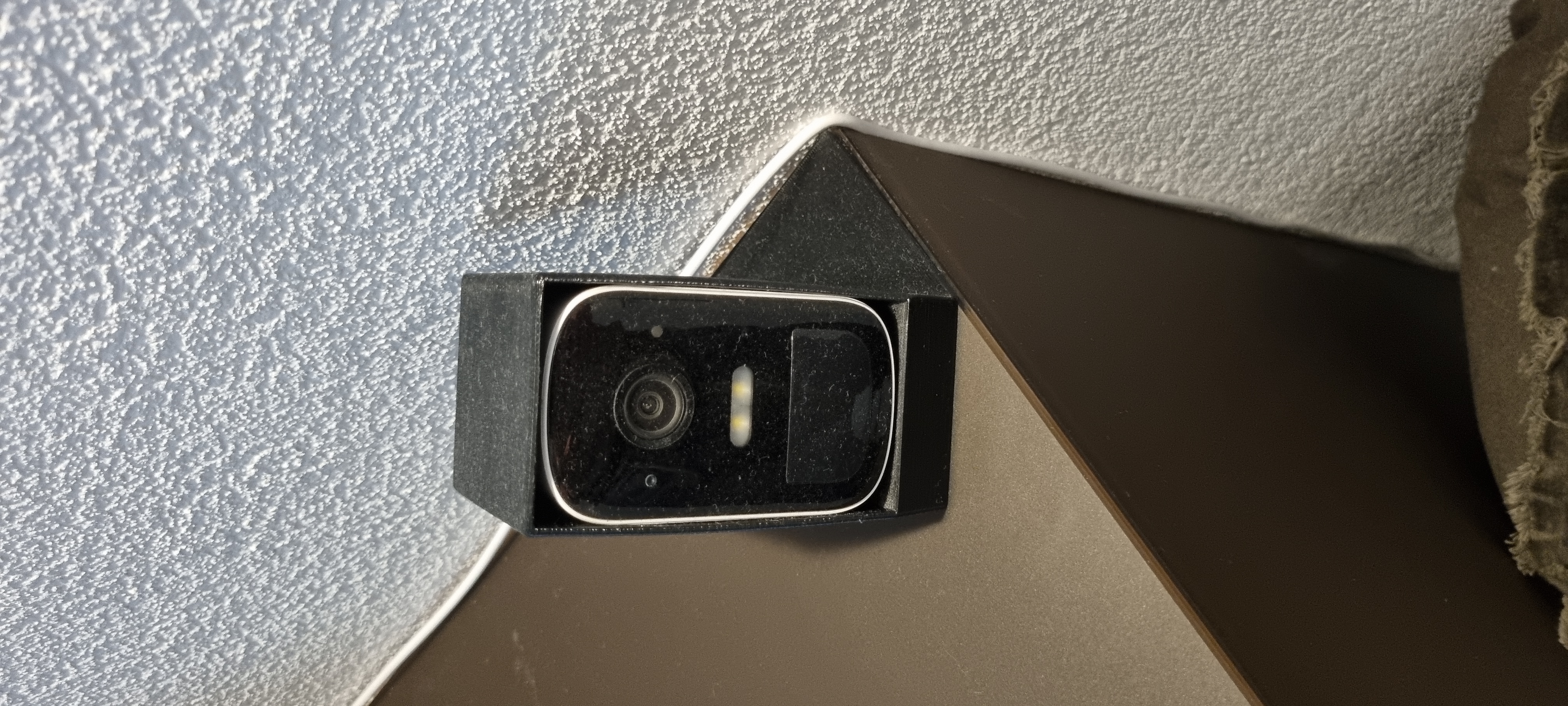 Security camera housing holder