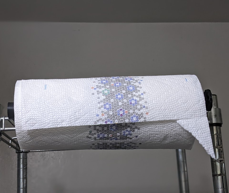 Paramaterized paper towel holder for wire rack shelving