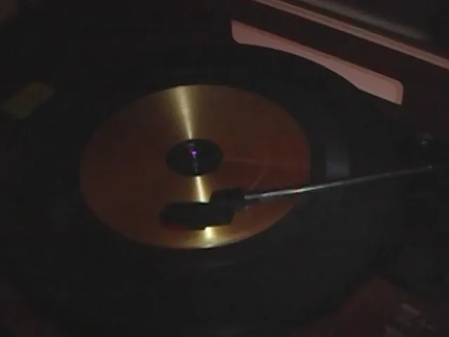 Playable Record with 45RPM adapter