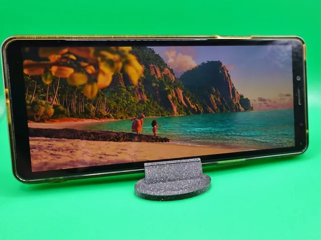 Mobile phone holder for watching movies
