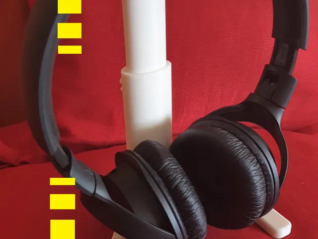 Soporte telescópico de altura variable para auriculares de diadema. Variable-height telescopic support for headphones.