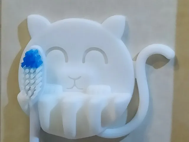 Catty toothbrush hanger