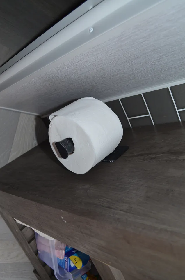 Toilet paper holder for camper. Attached with velcro.