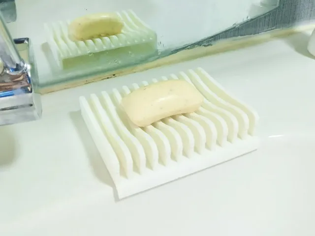 Soap holder with water drain