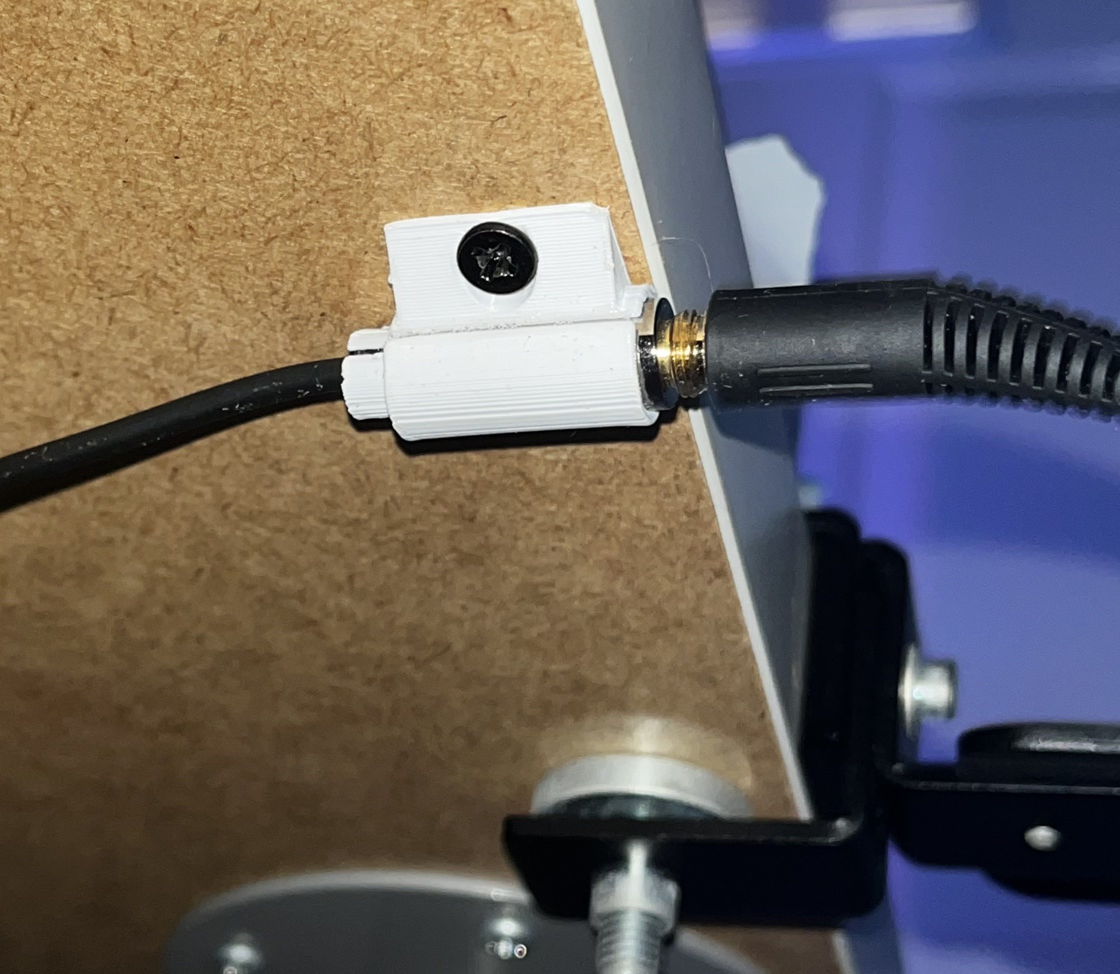 Headphone cable under desk mount