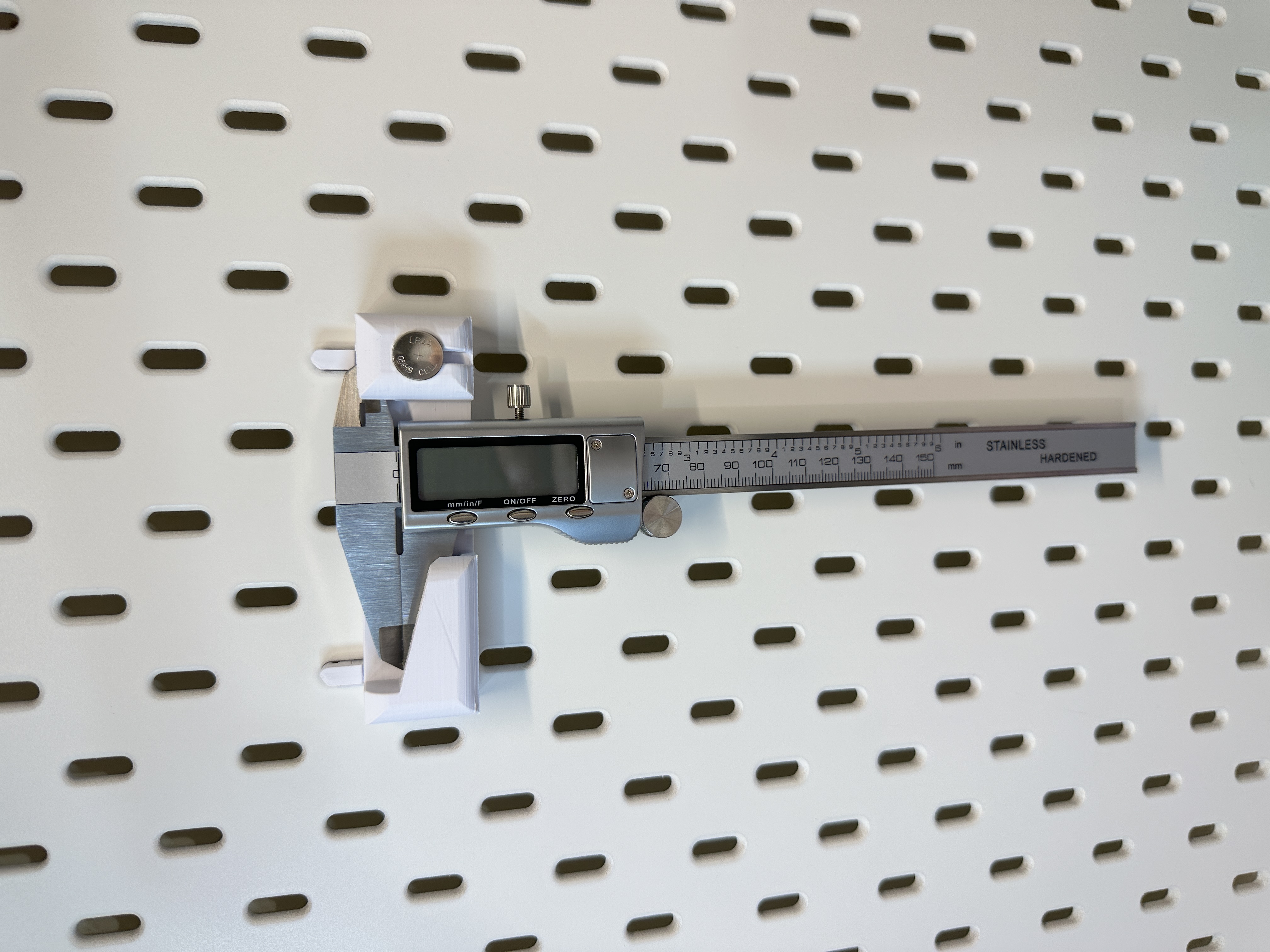 Caliper Bracket for Skadis + Battery Holder with Locking Peg Mount - Remix.