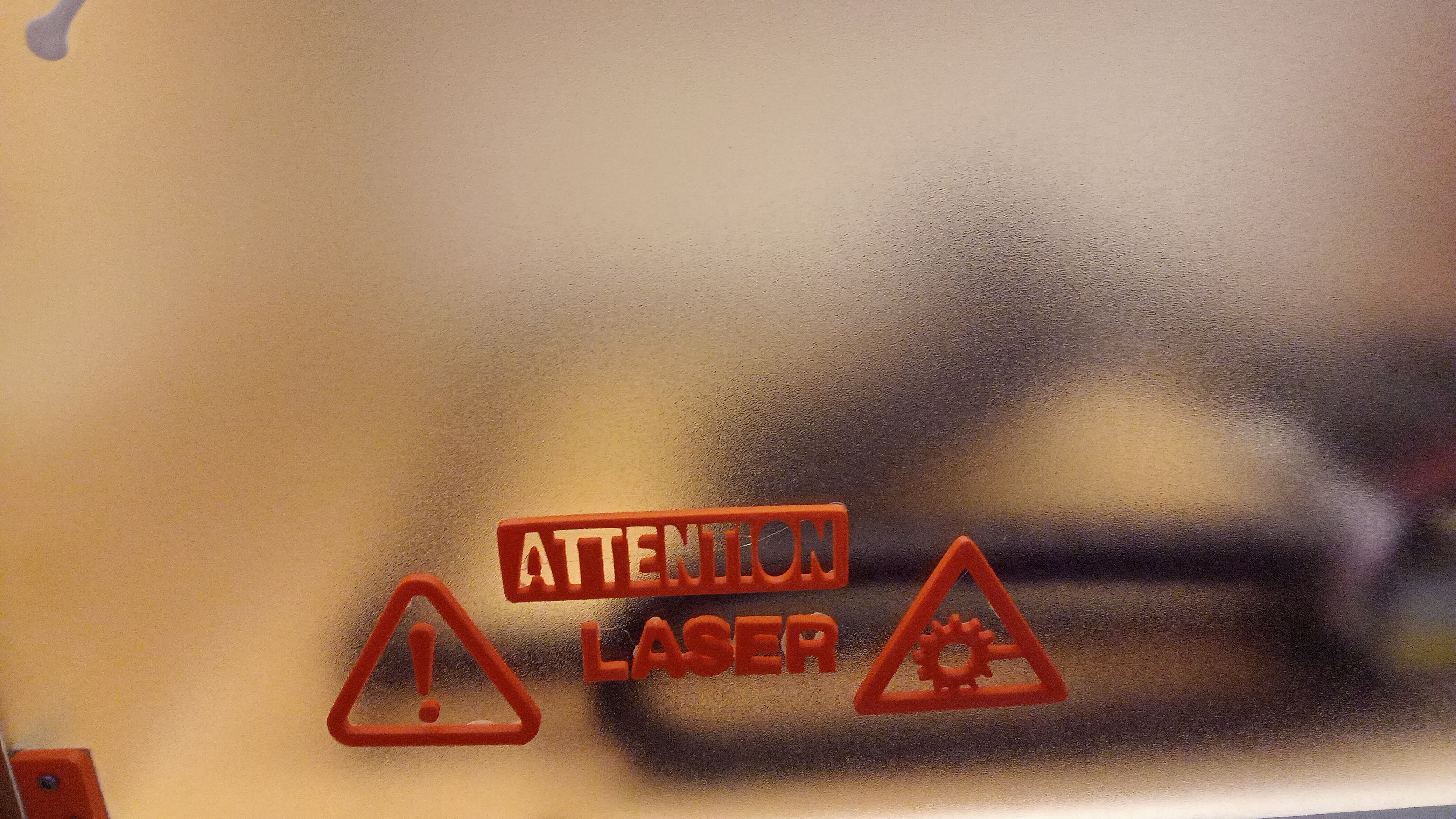 sign "attention laser" for a laser enclosure