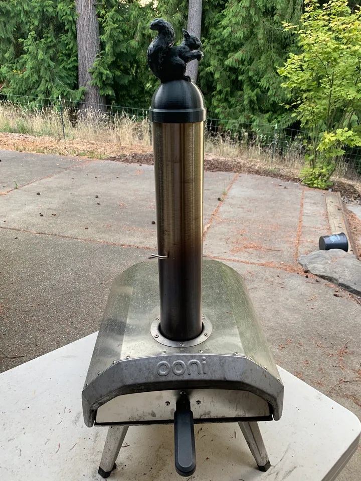 OONI pizza oven chimney cap featuring a squirrel by jamesreinders