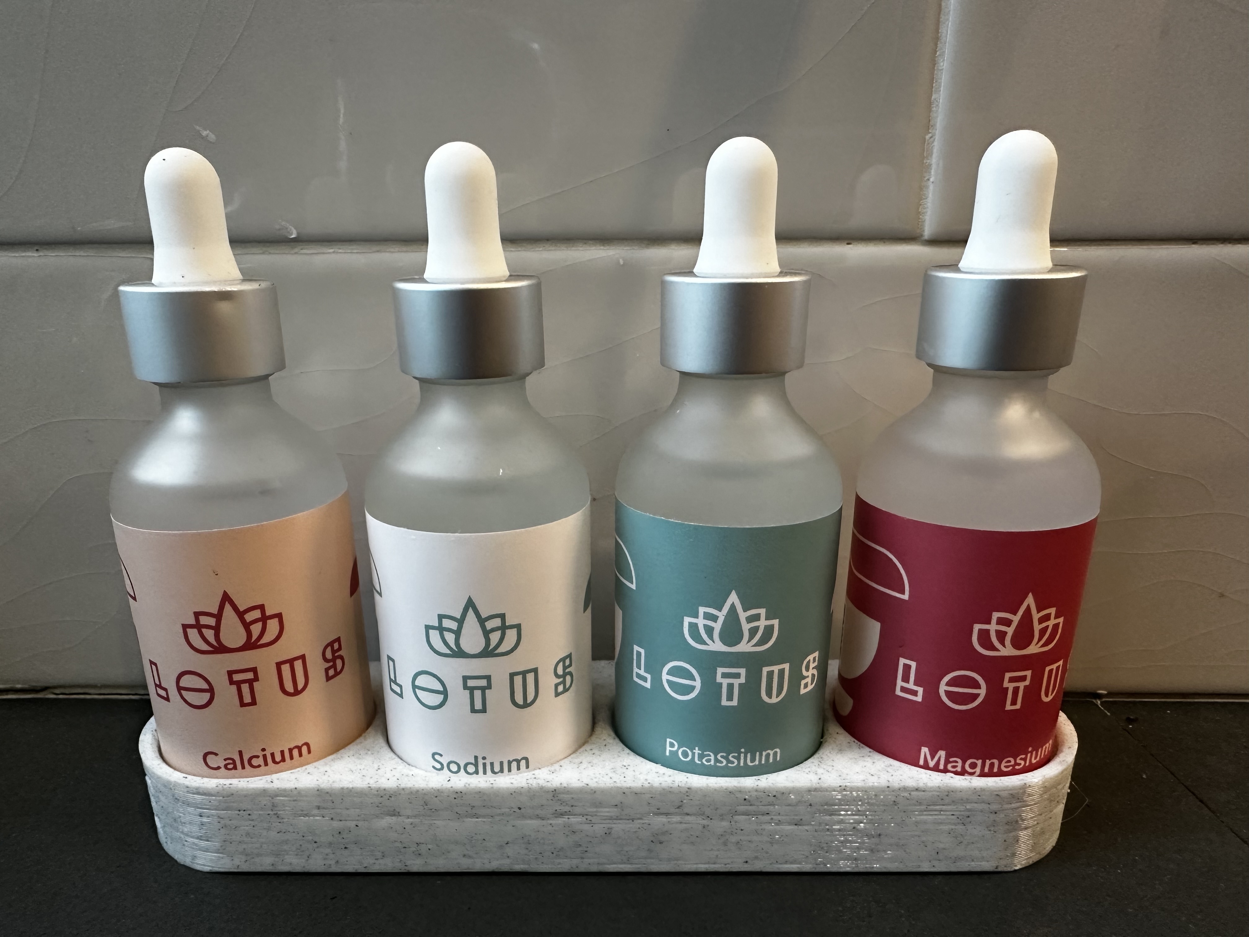 Lotus Water dropper bottle holder by Jono Download free STL model