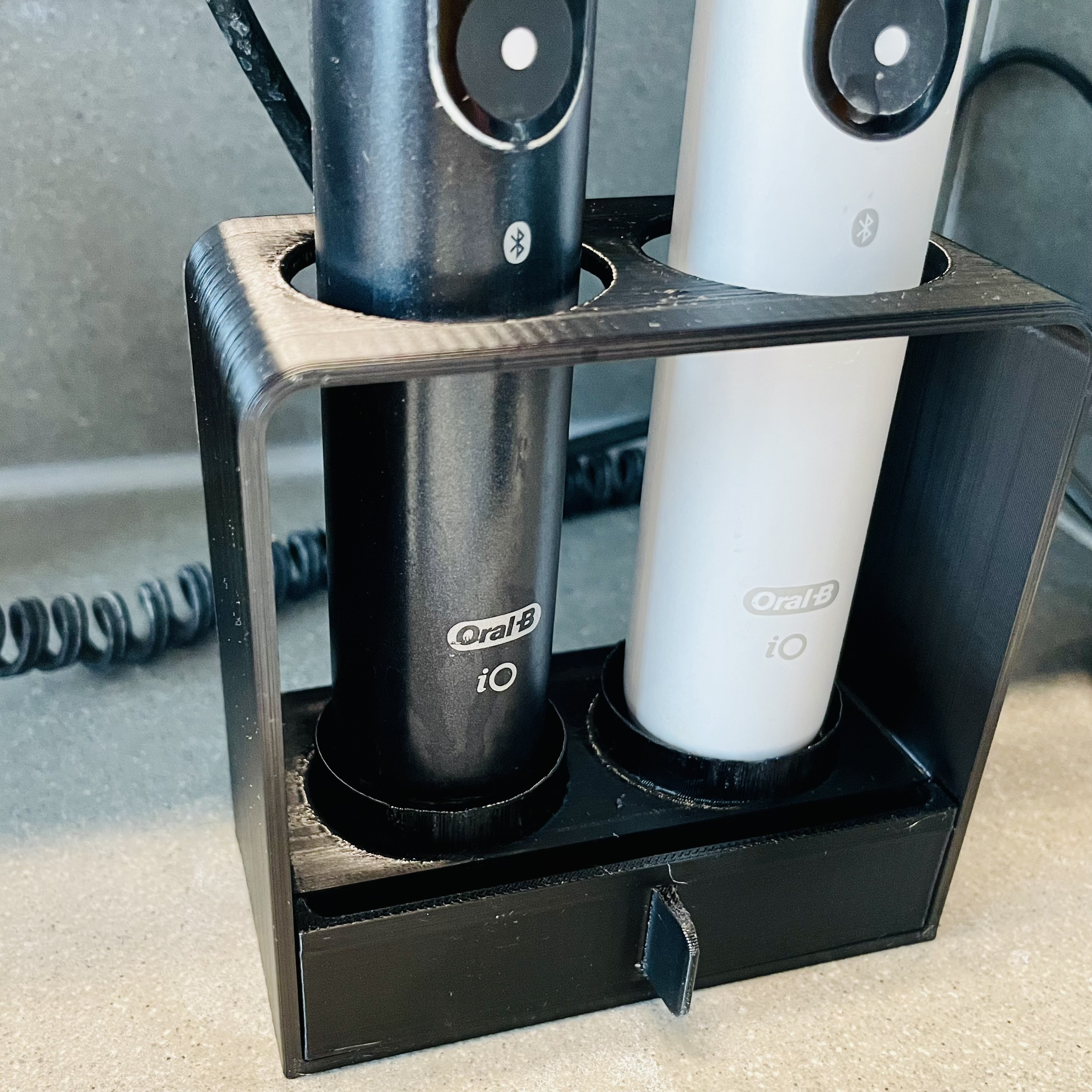 Electric toothbrush stand with drip tray by Allan Mertner Download free STL model