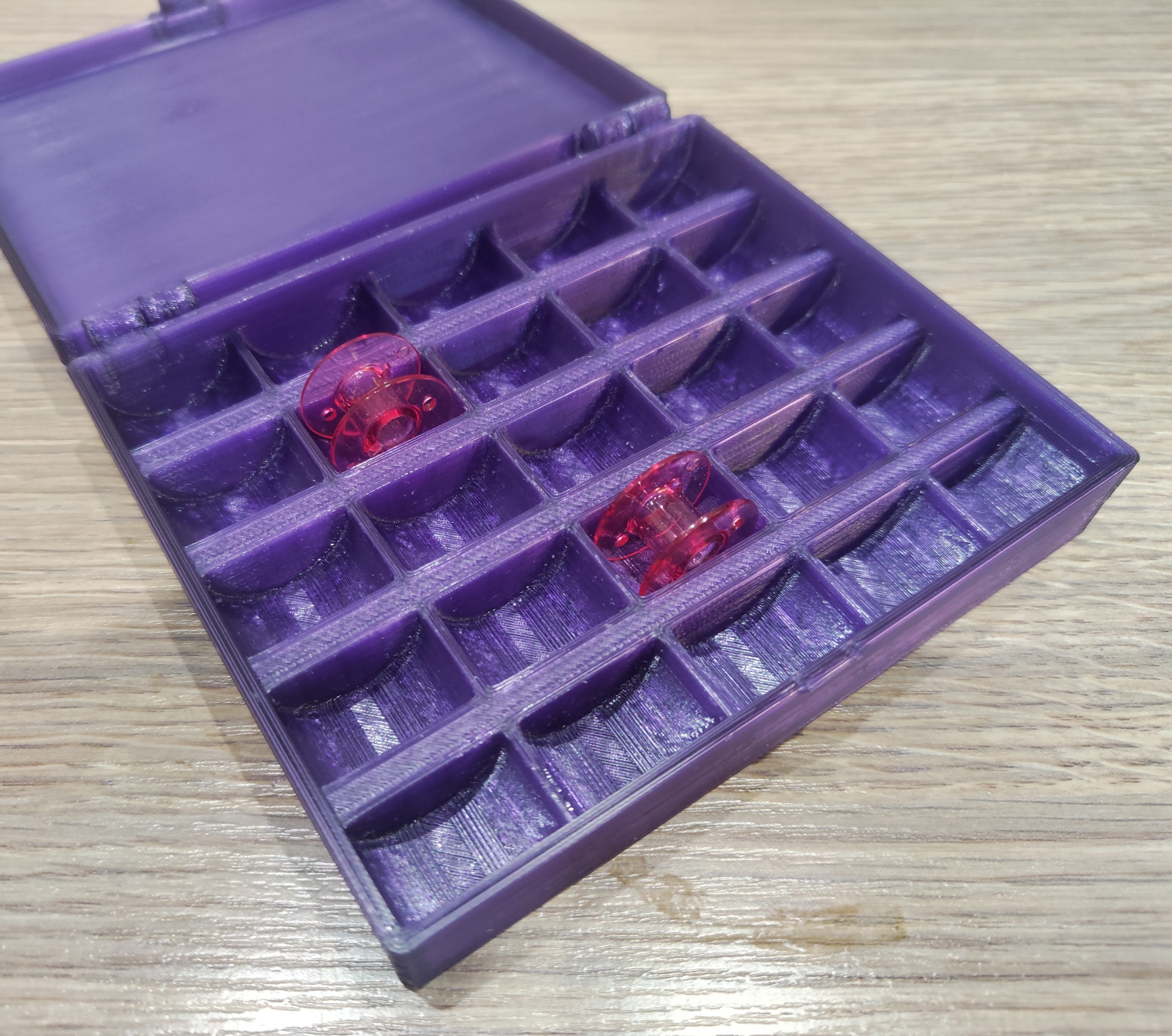 Storage box for sewing thred spools